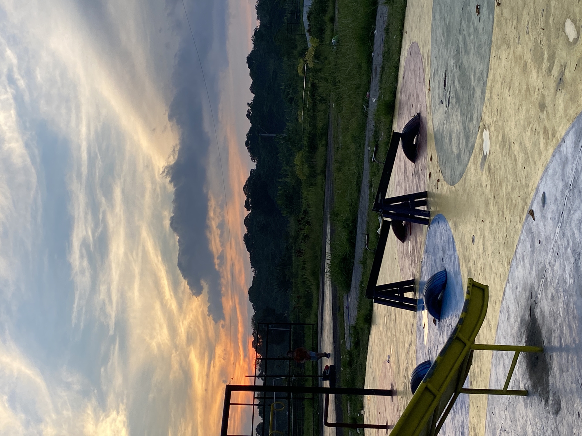 Davao neighborhood park and streets at sunset