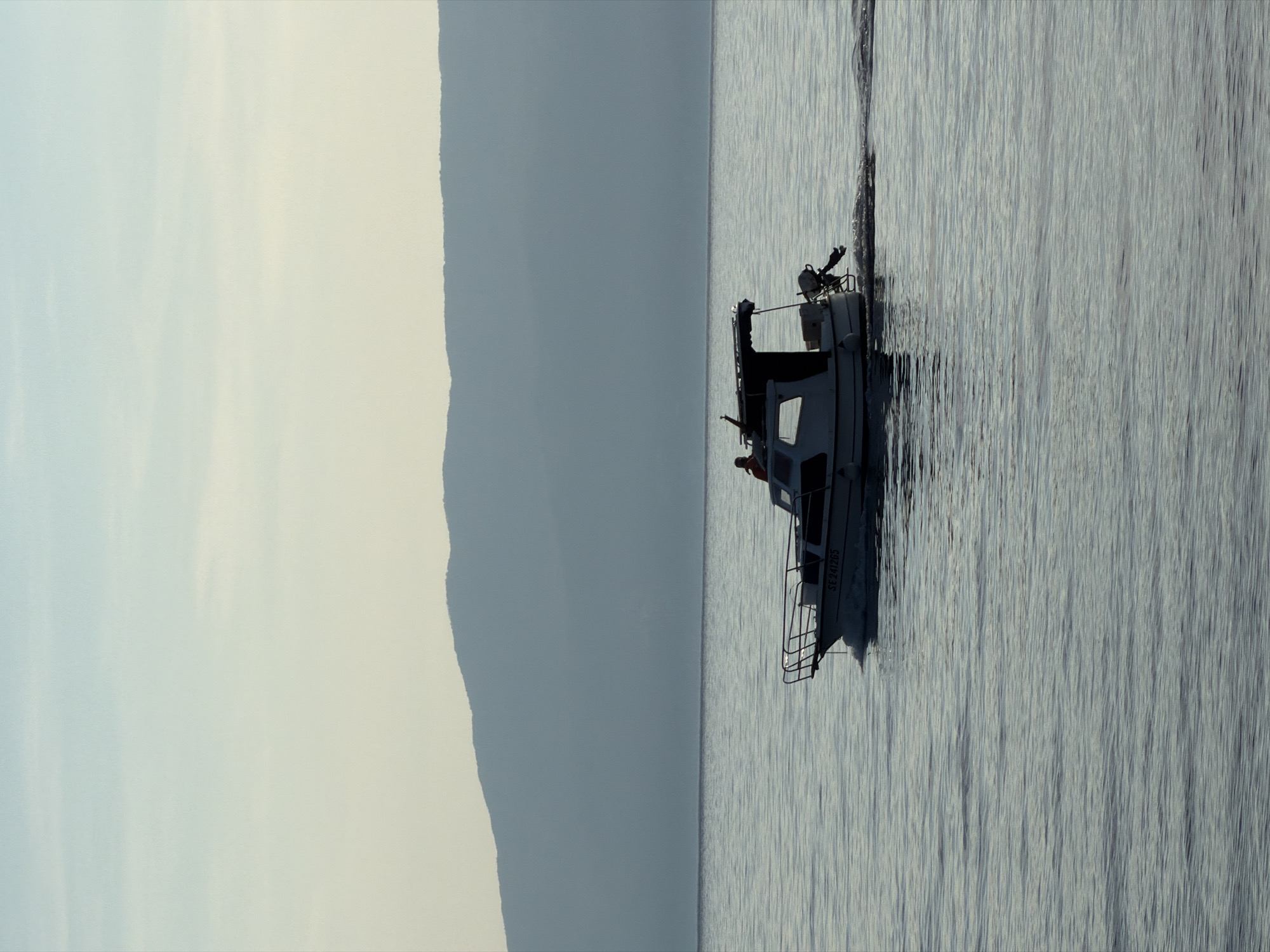 White boat spotted in calm waters near Rijeka, Croatia