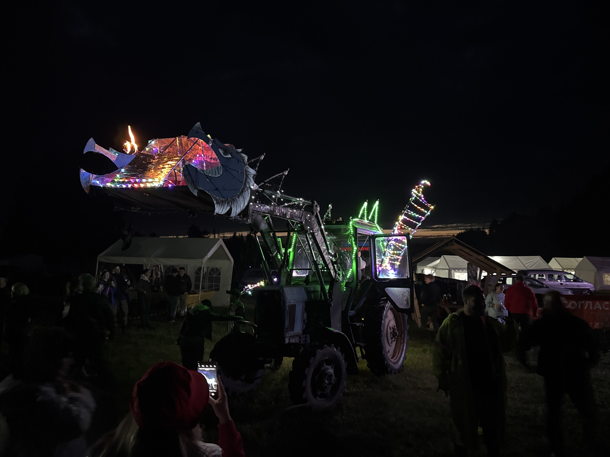 Modified tractor draws crowd to nighttime gathering in Russian town