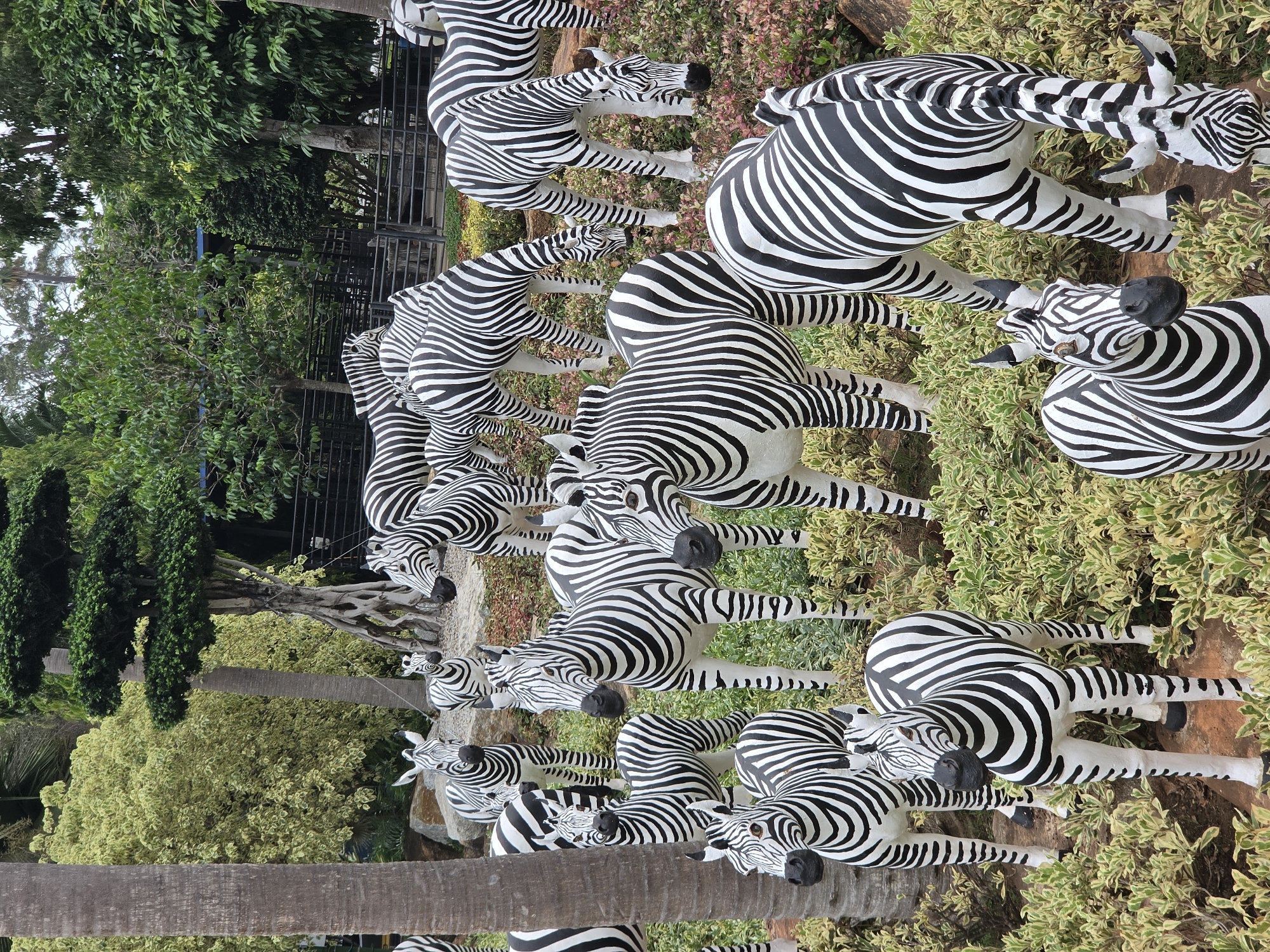 Animal sculpture displays documented at Thai tropical garden
