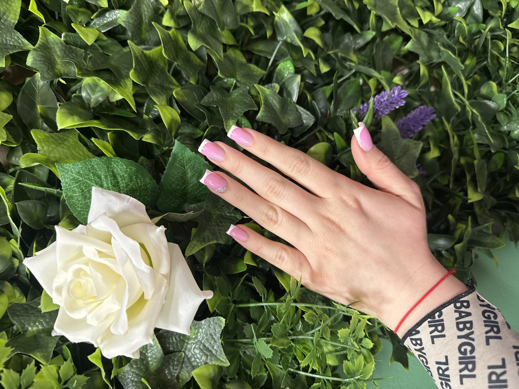 Manicured hand photographed with flowers in Burgas, Bulgaria