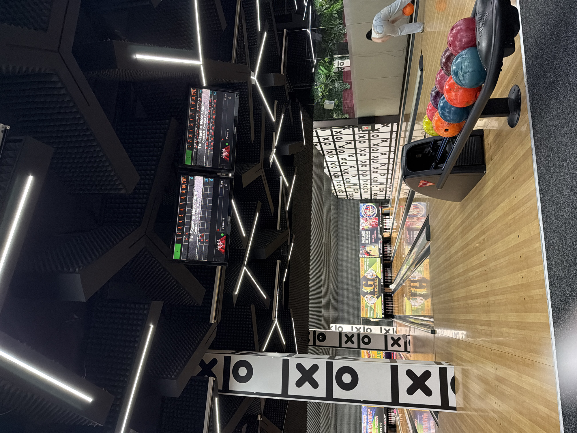 Friends bowl with pet poodle at Burgas entertainment venue