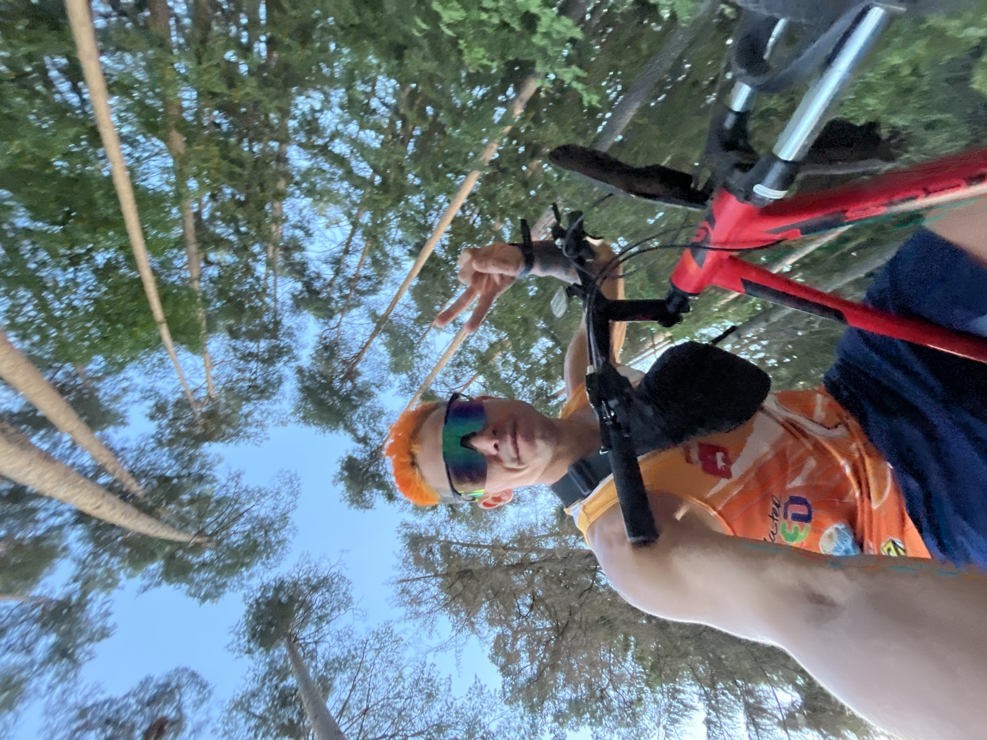 Orange-haired cyclist documents bike ride through Russian countryside
