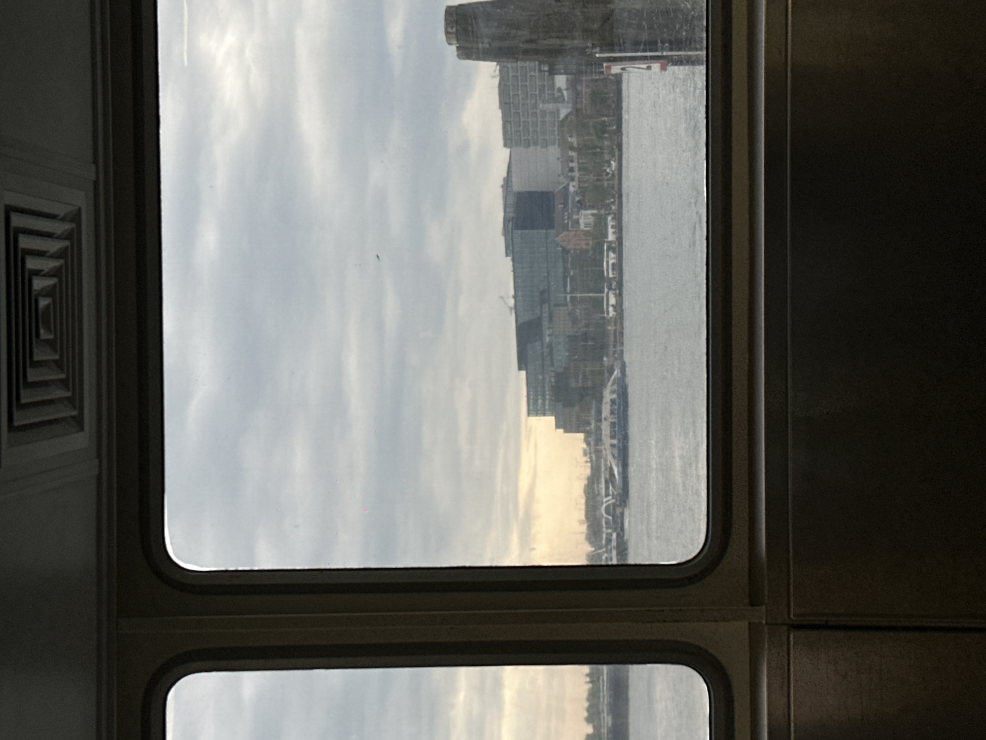 Morning commuter documents train journey through Amsterdam