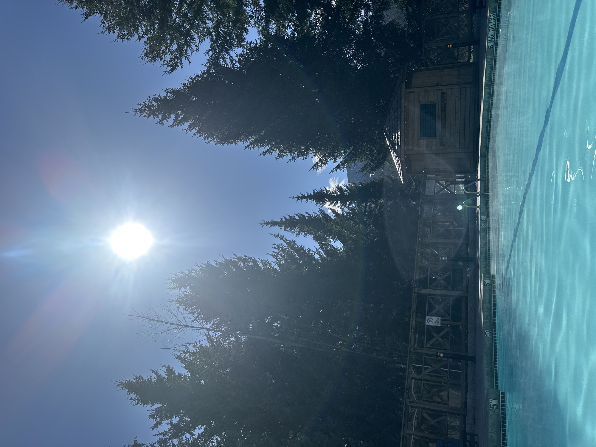 Outdoor pool facility documented in sunny Whistler mountain setting