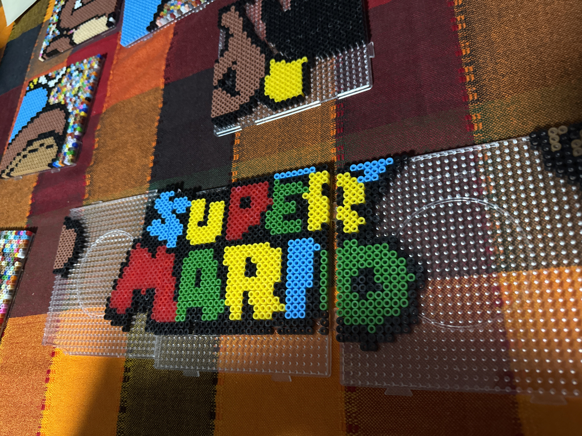 Perler bead Super Mario logo crafted in Puebla