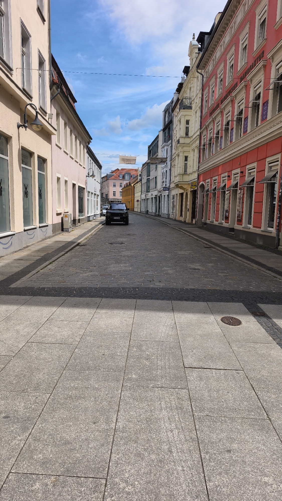 Tourist documents European city walk through historic districts