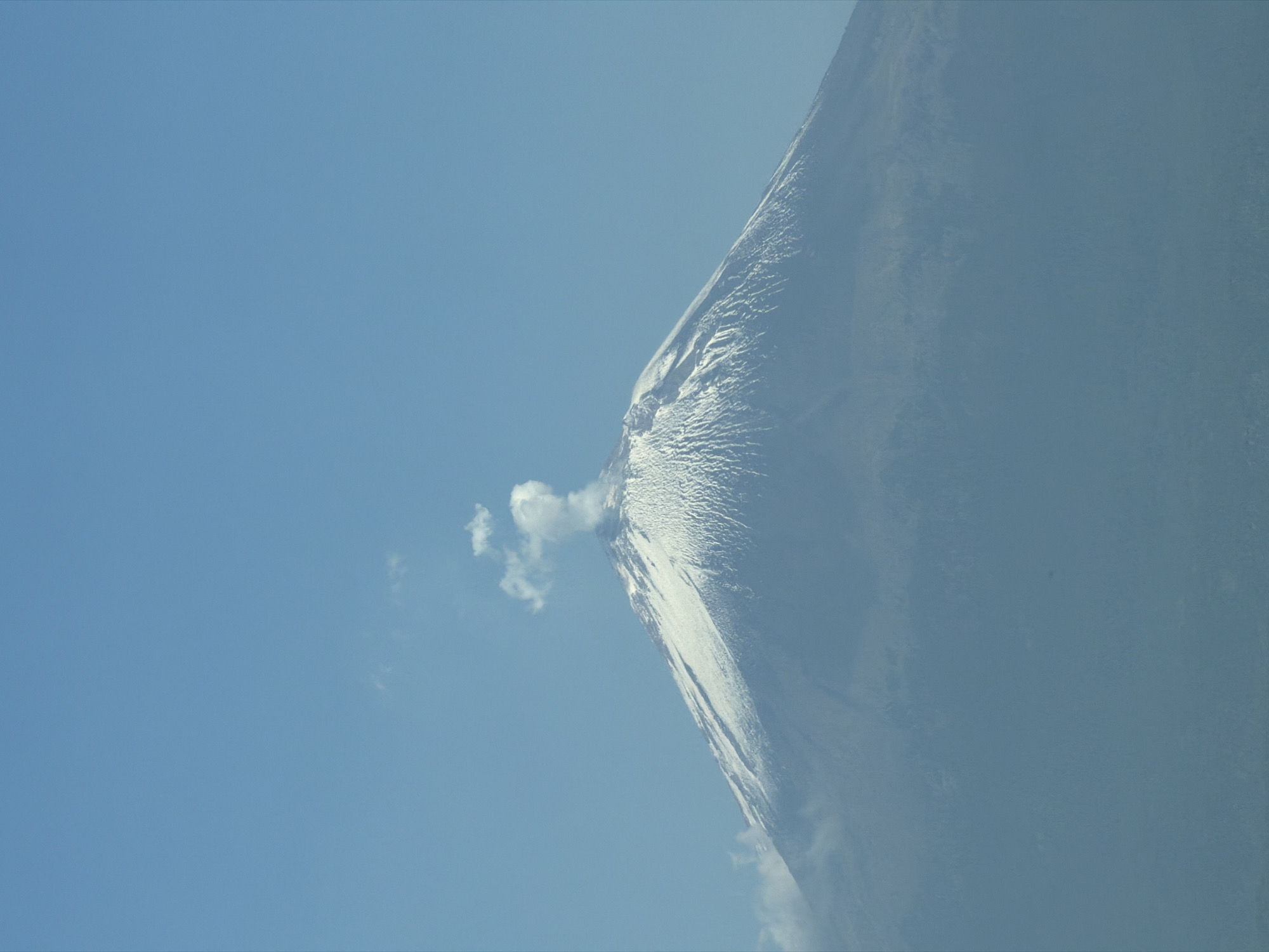 Snow-covered volcano emits smoke plume in Mexico