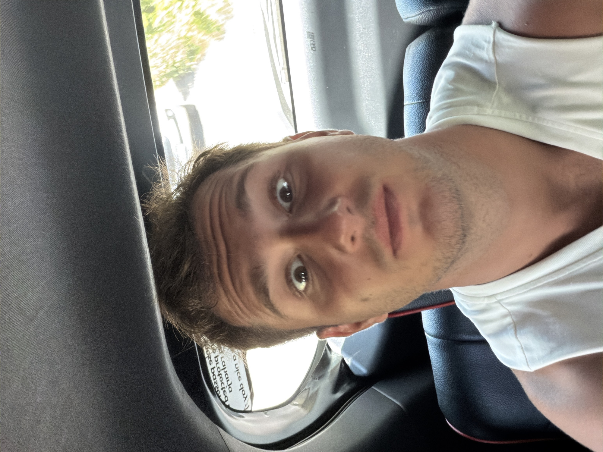 Man photographed in car backseat in Batununggul, Indonesia