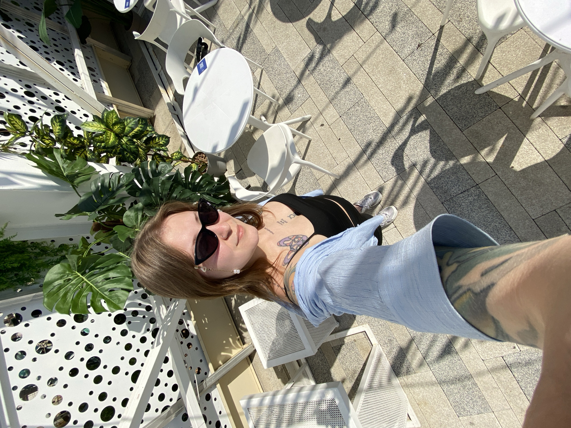 Woman takes morning selfie near Ferris wheel in Saratov
