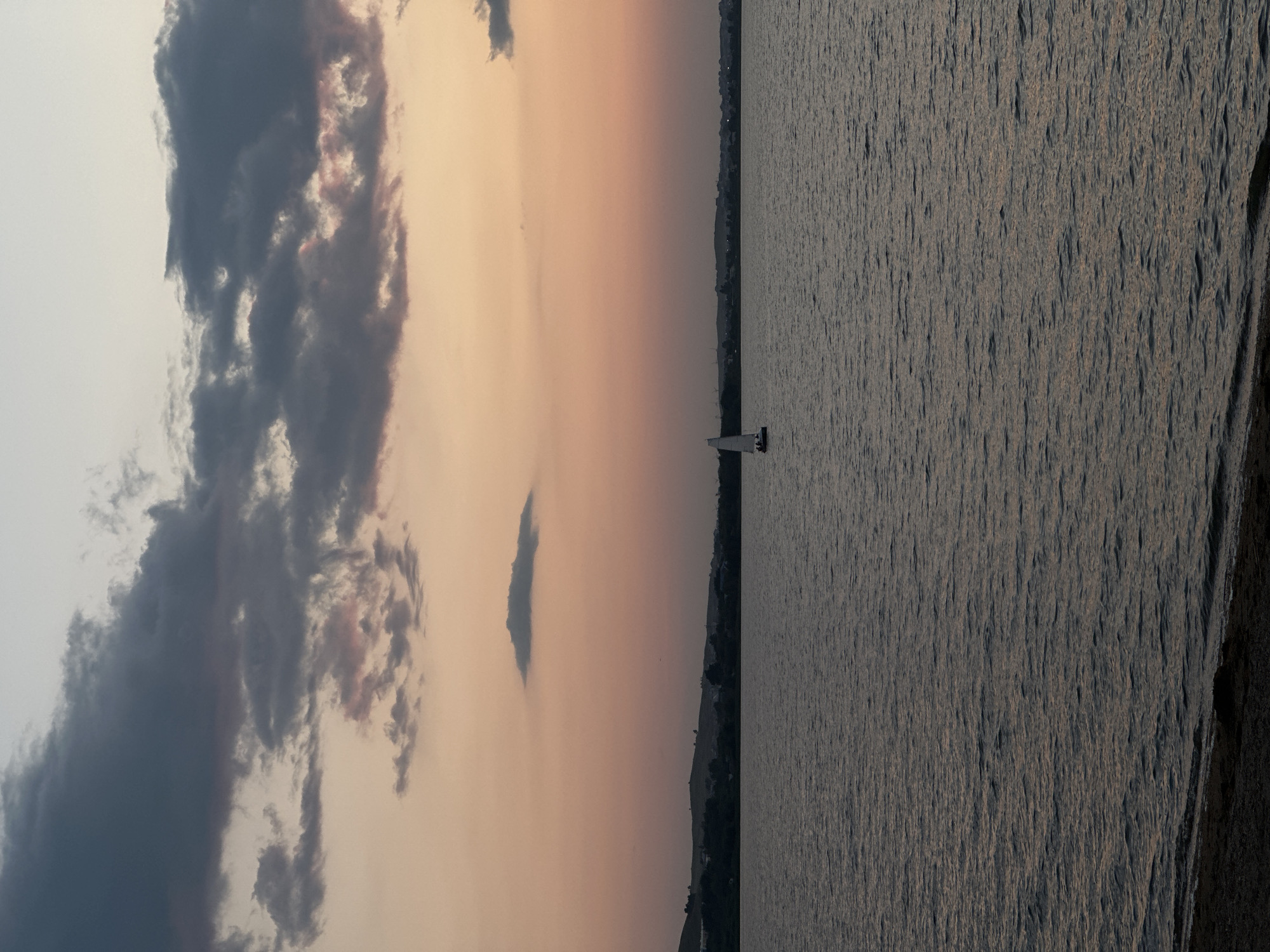 Sailboat on Lake Borovoe at golden hour, Kazakhstan