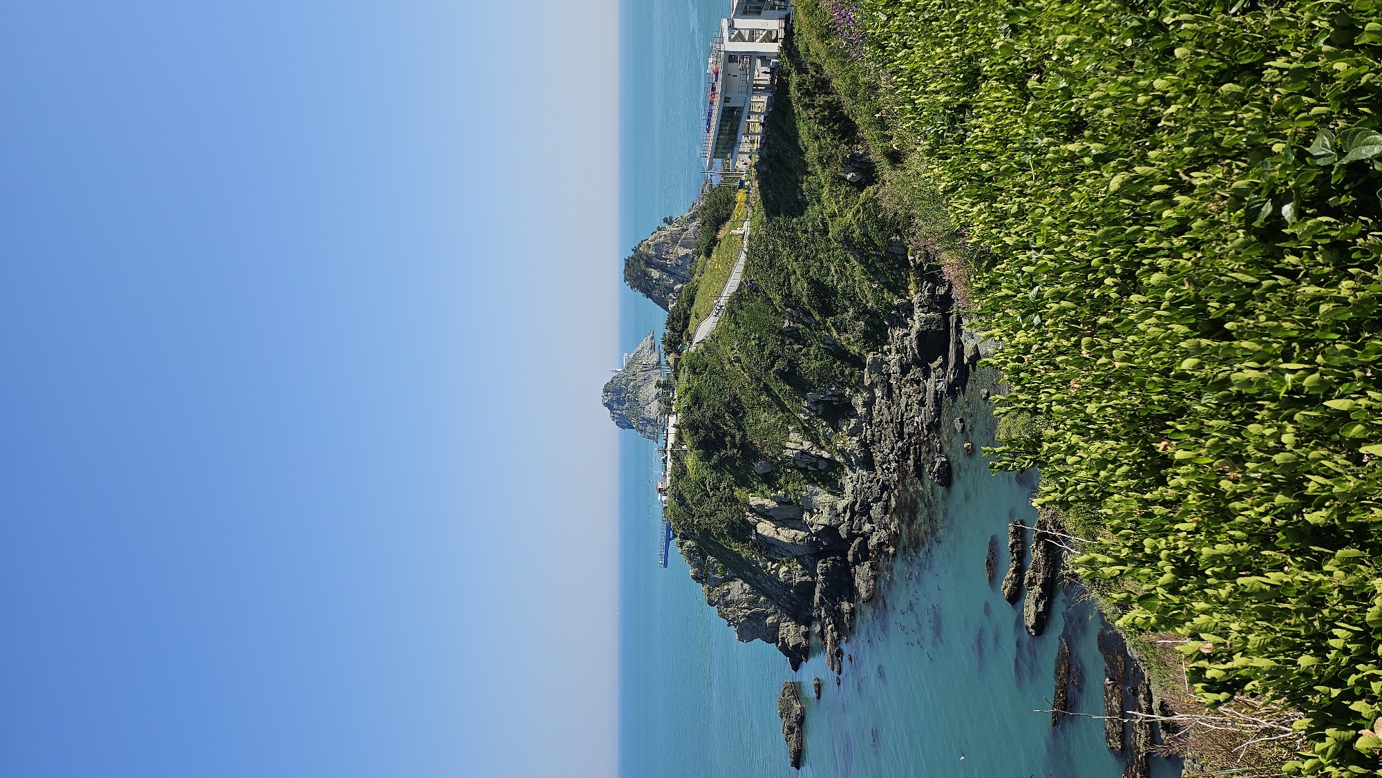 Morning coastal documentation captures Busan's rocky shores and statues