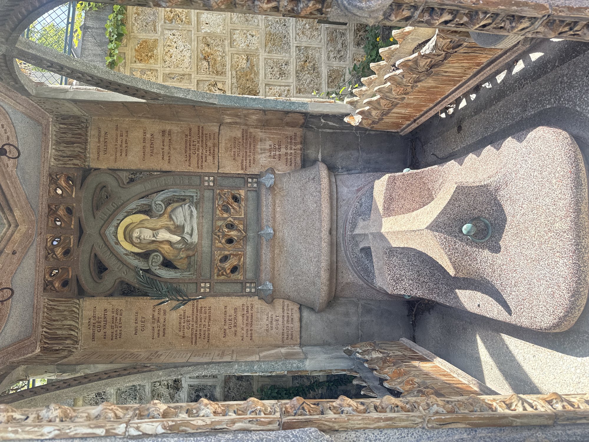 Visitor documents ornate tombs at Paris Montmartre Cemetery