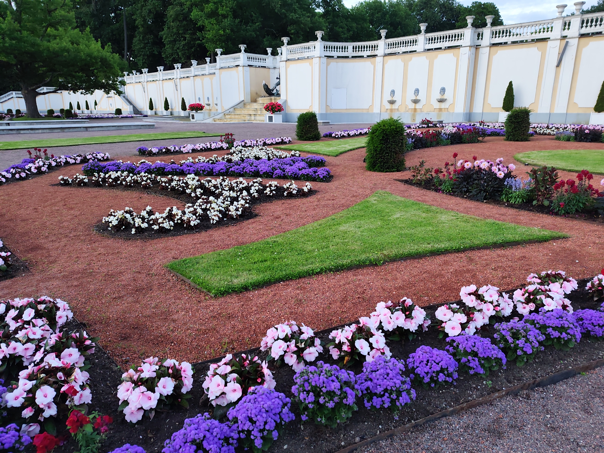 Evening stroll through a formal ornamental garden with fountains