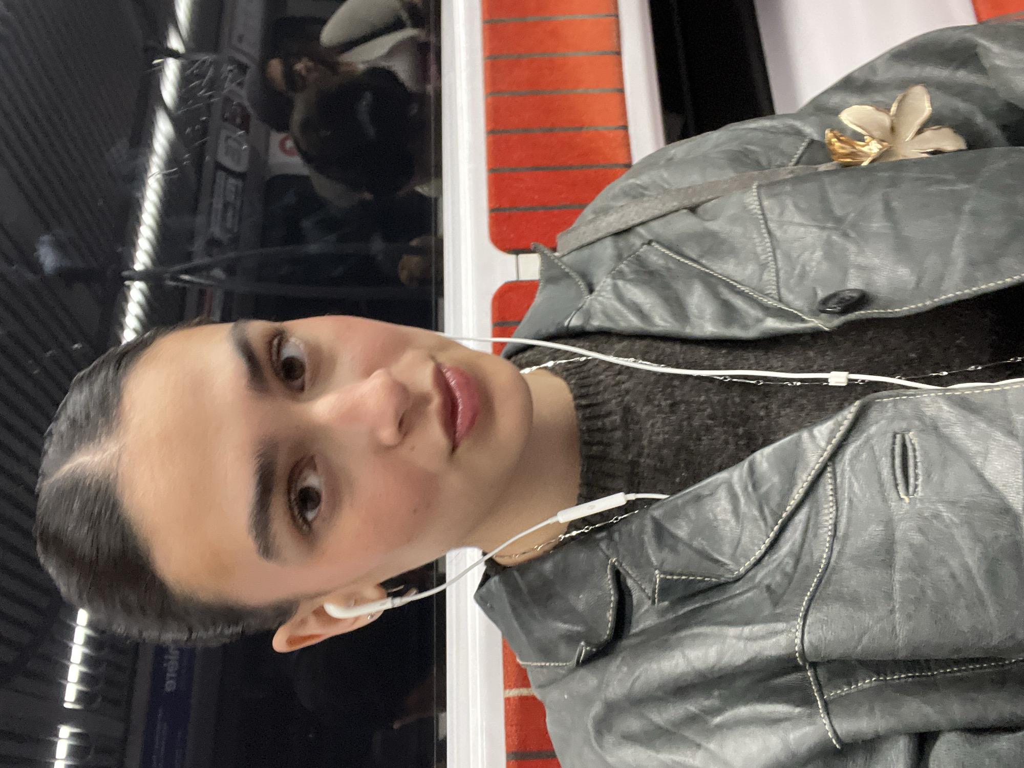 Young woman photographed on public transport