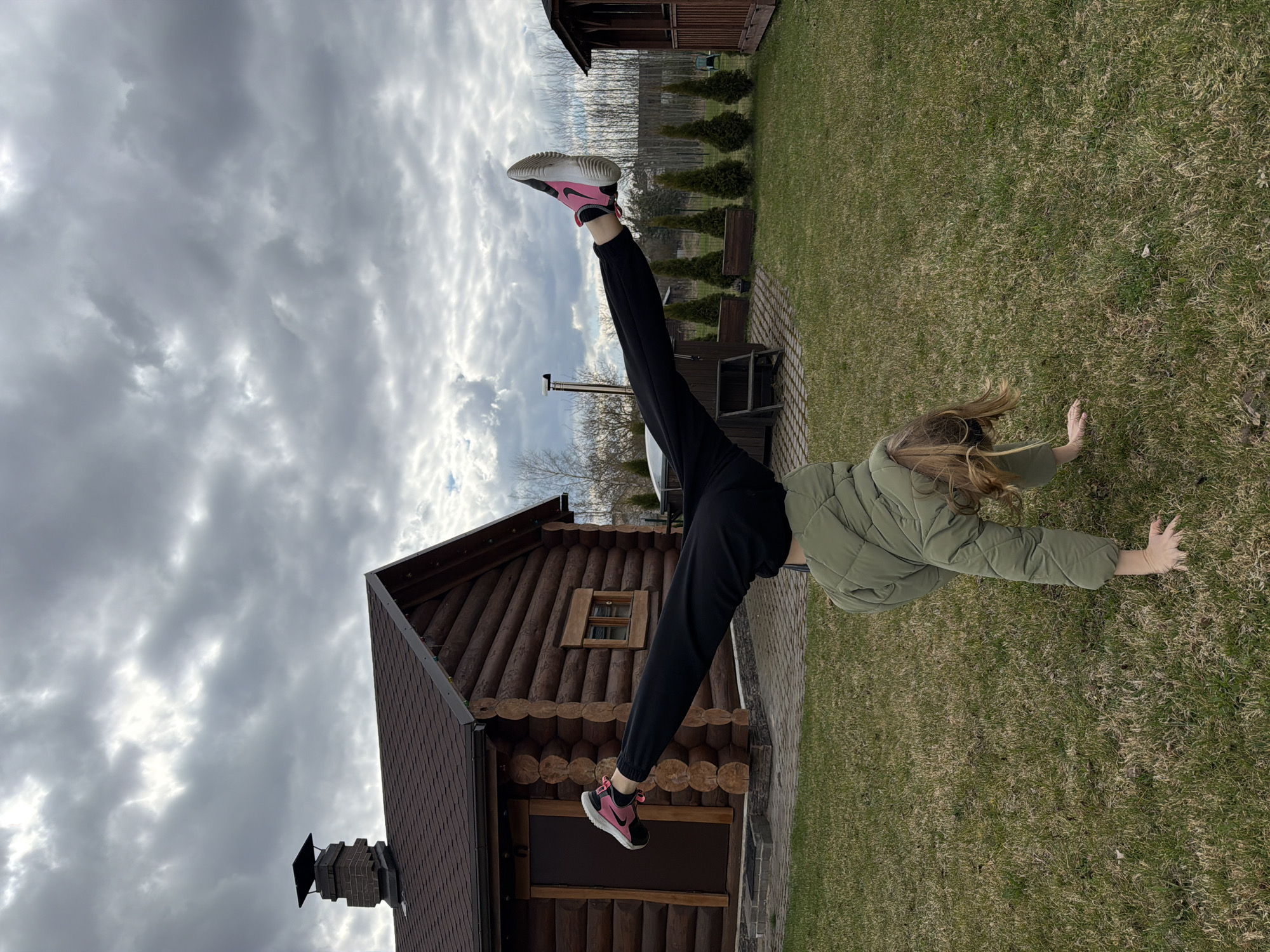 Woman performs handstands, plays badminton in Dreiliņi backyard