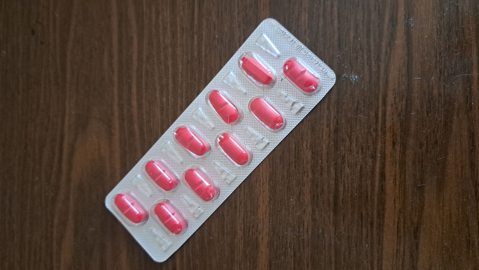Pills and a hot drink, close up