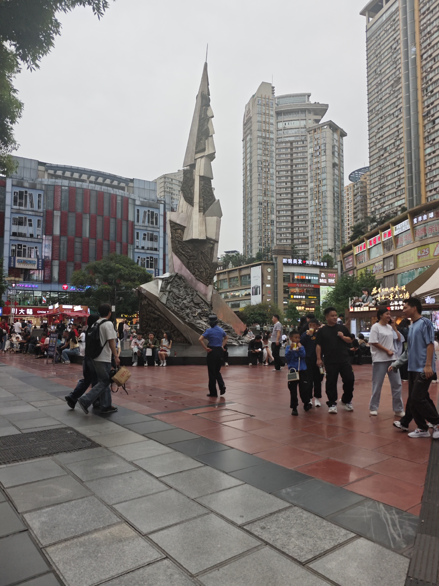 Busy pedestrian square activity documented in Shapingba District, China