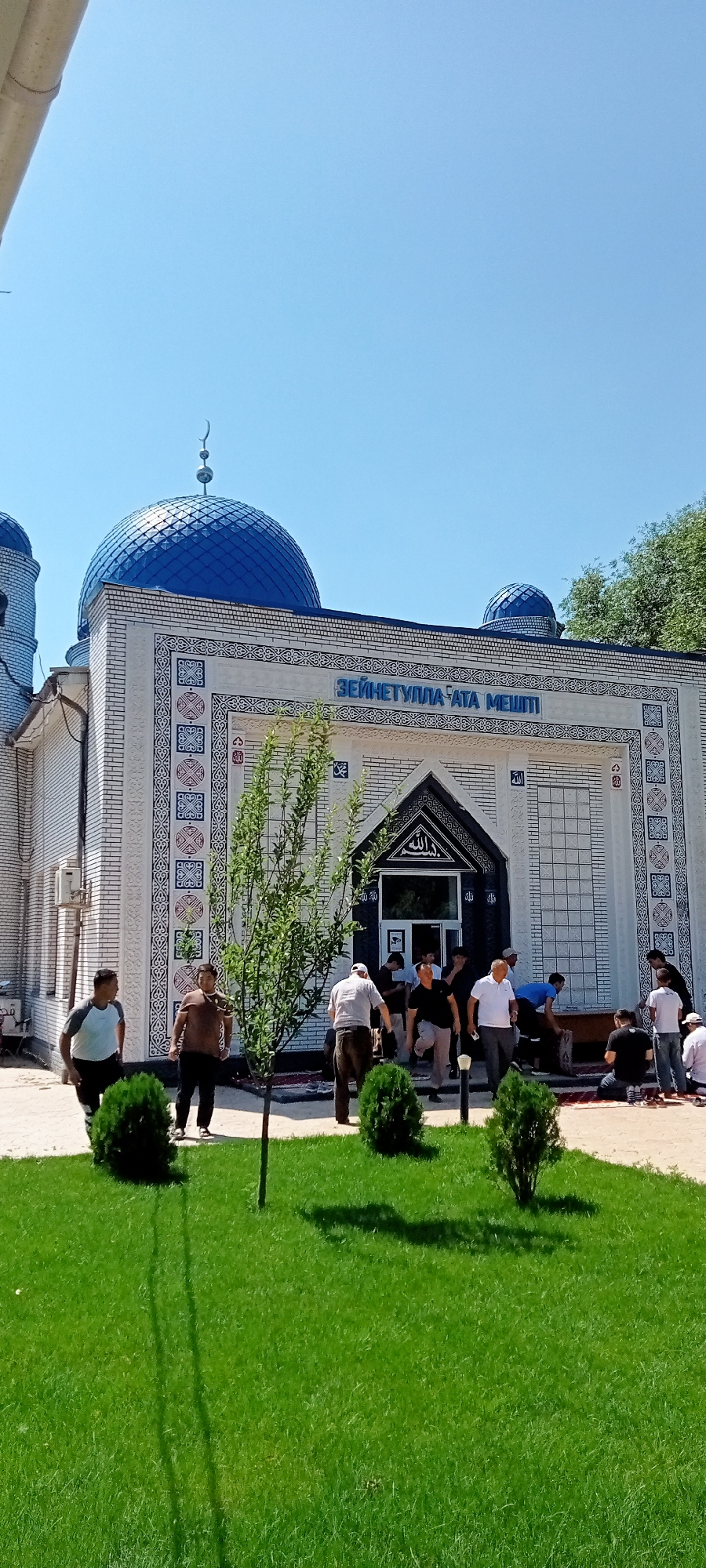 Blue-domed mosque with decorative tilework in Besagash, Kazakhstan