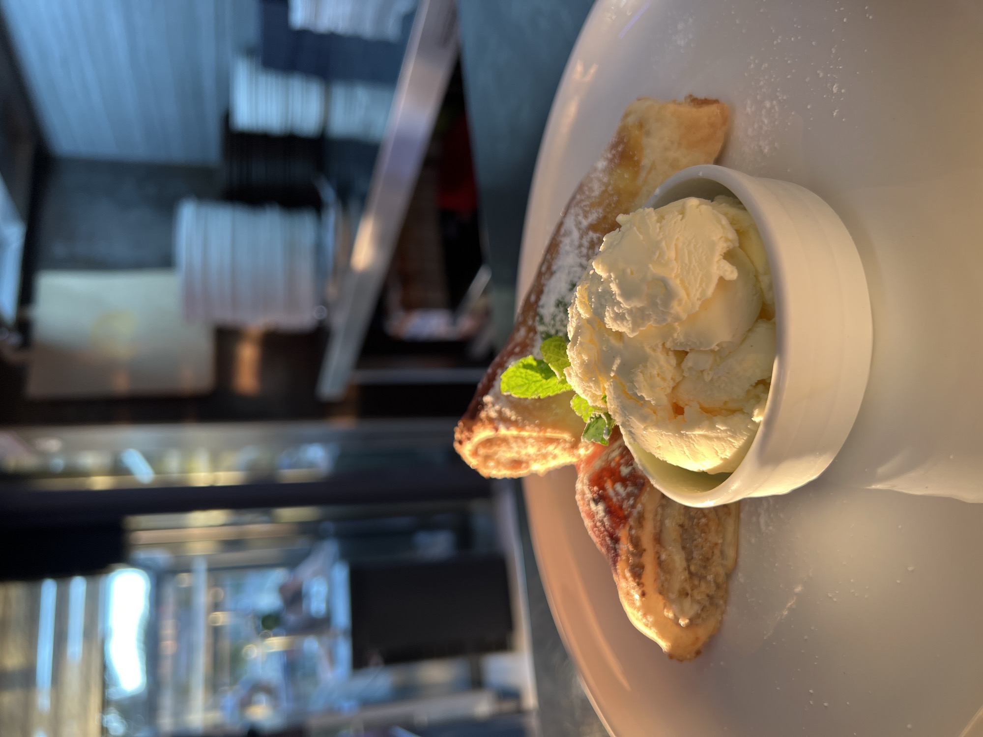 Restaurant patron enjoys dessert in Budva, Montenegro