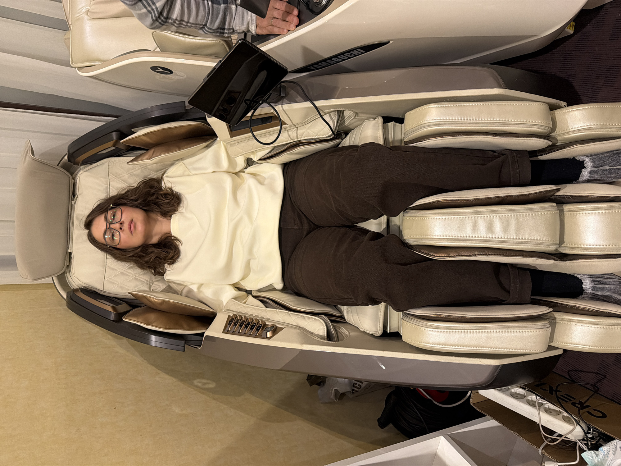 Woman uses massage chair in Izhevsk, Russia