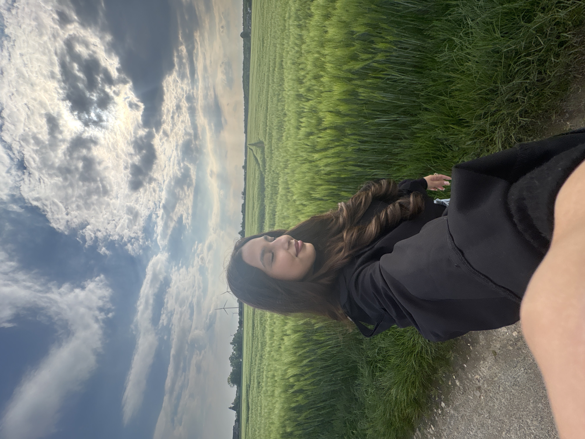 Woman takes selfies on rural road near Wegberg, Germany