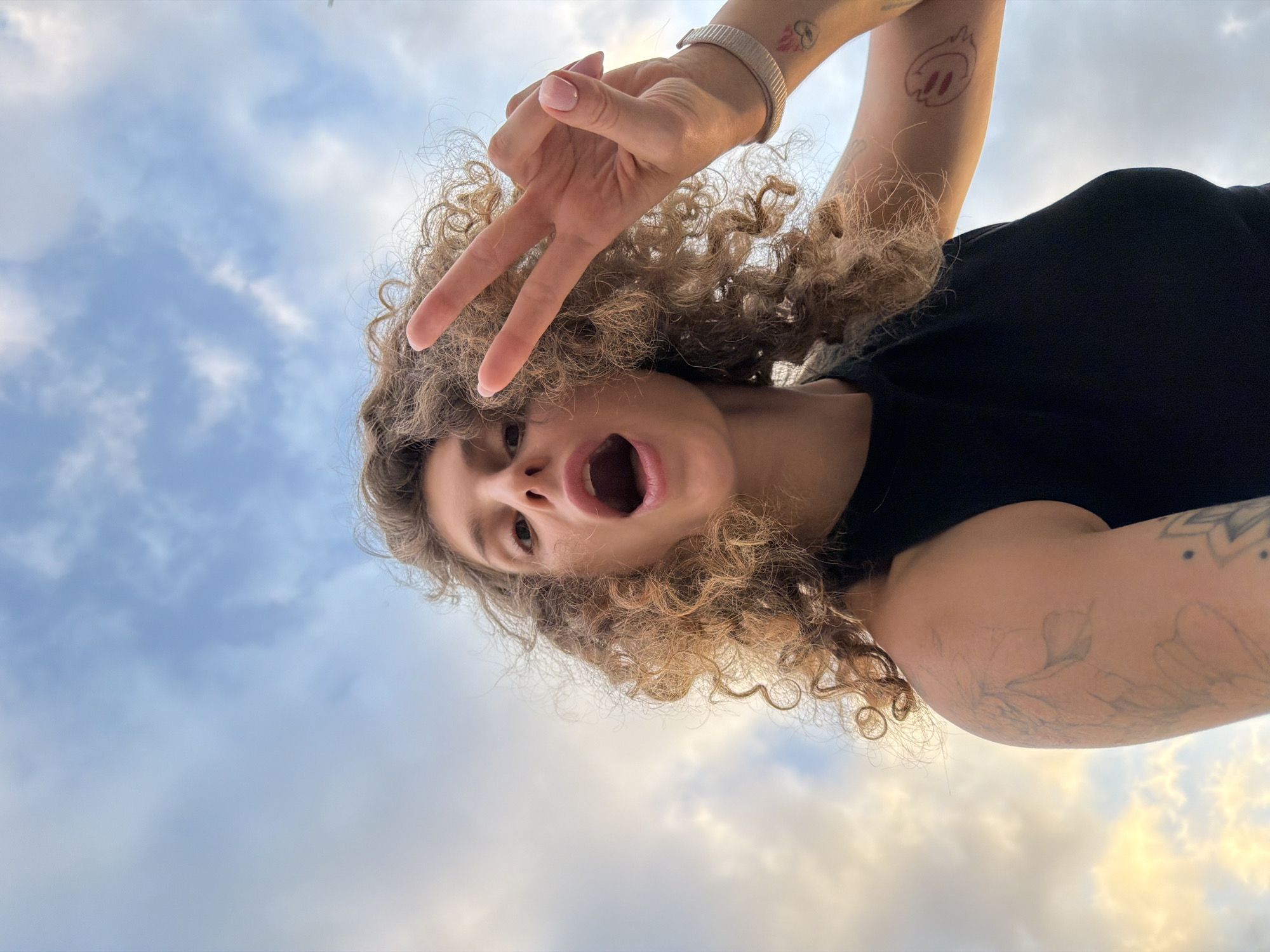 Woman takes creative photo session during dramatic sunrise in Bali