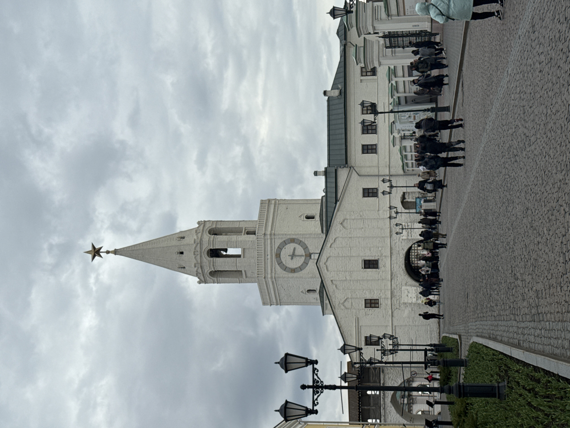 Tourists visit historic Kazan tower, horse carriage operates nearby