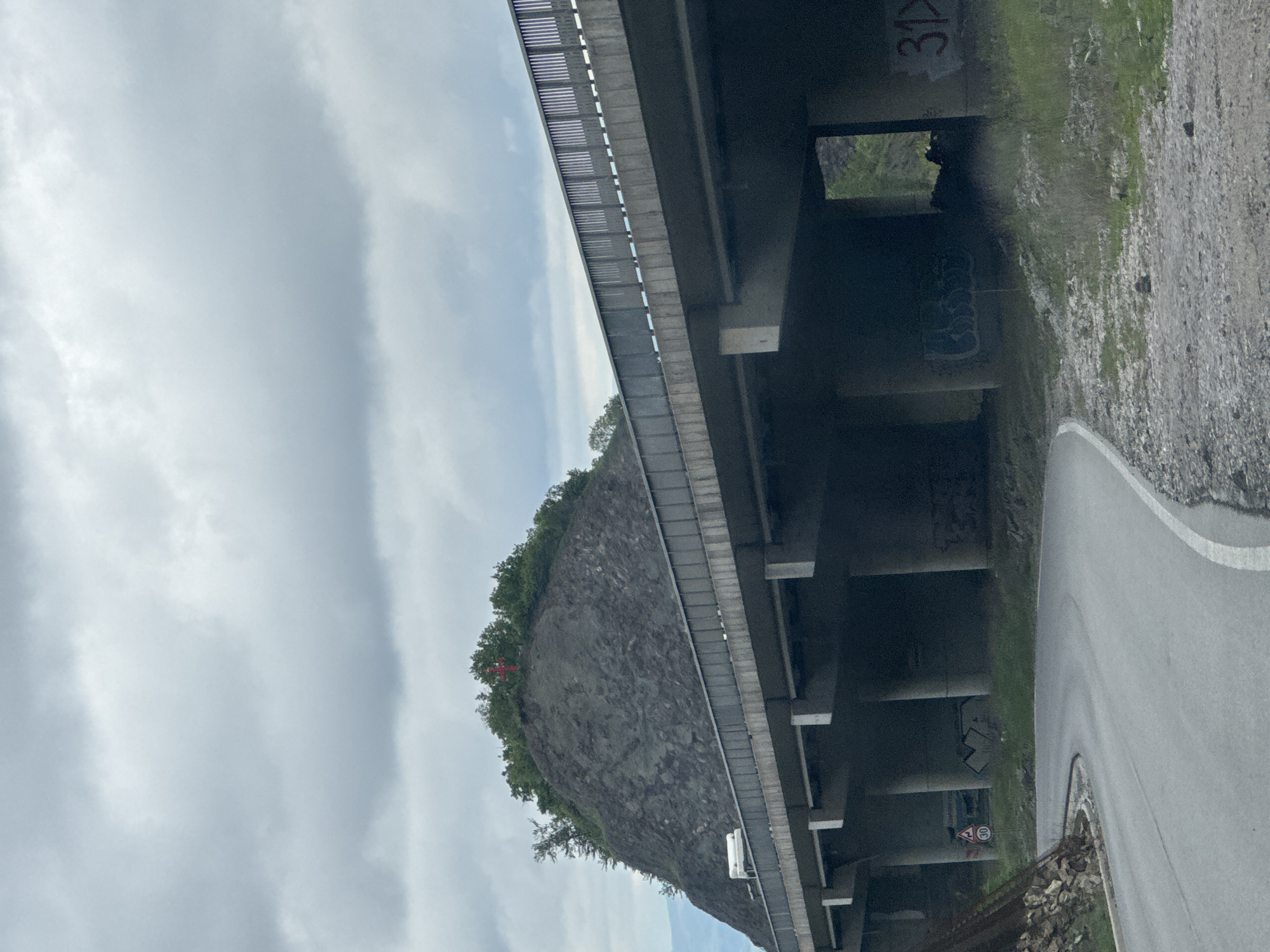 Concrete bridge structure observed spanning roadway near Malo Buchino