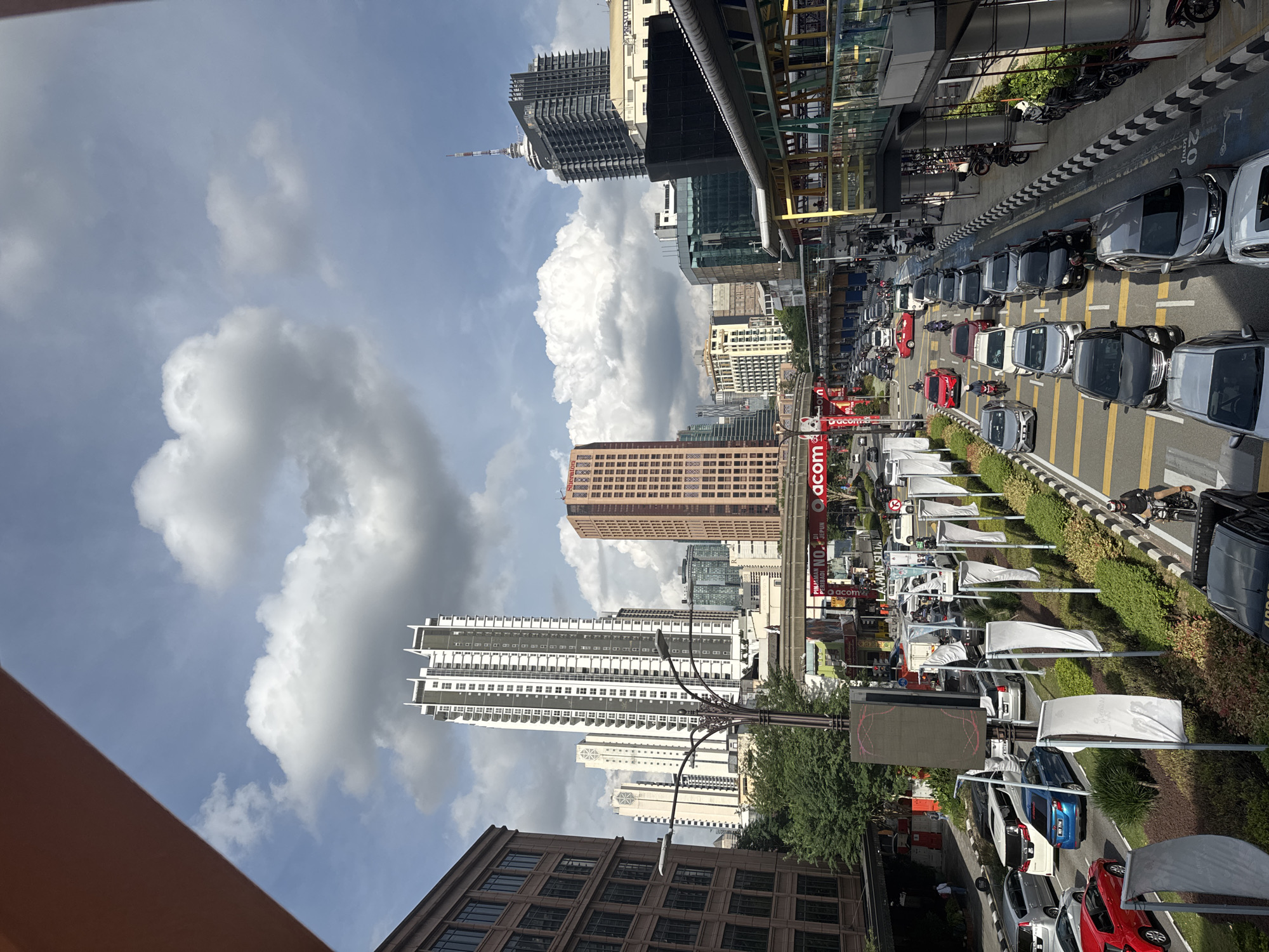 A KL morning: city streets, tourist buses, and supermarket aisles