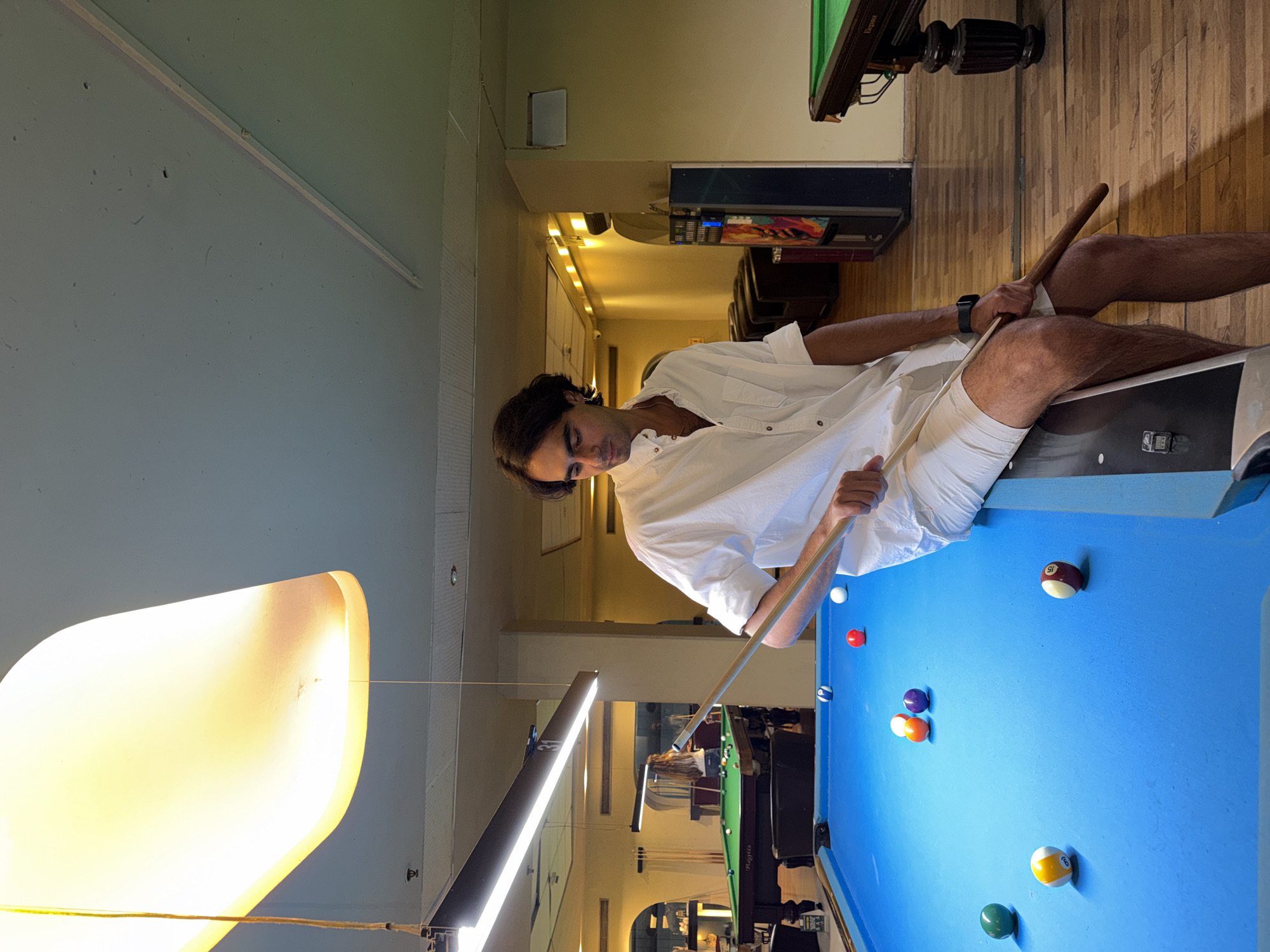 Pool game in progress at a Tel Aviv billiards hall
