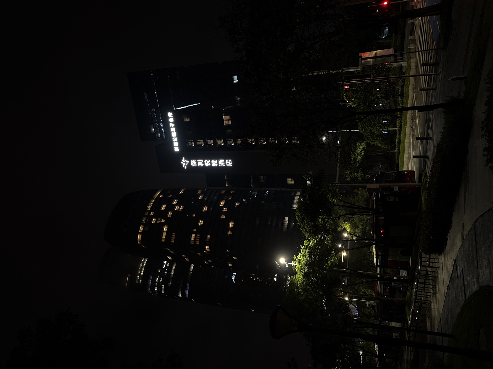 Haizhu District waterfront and streets on a wet June night