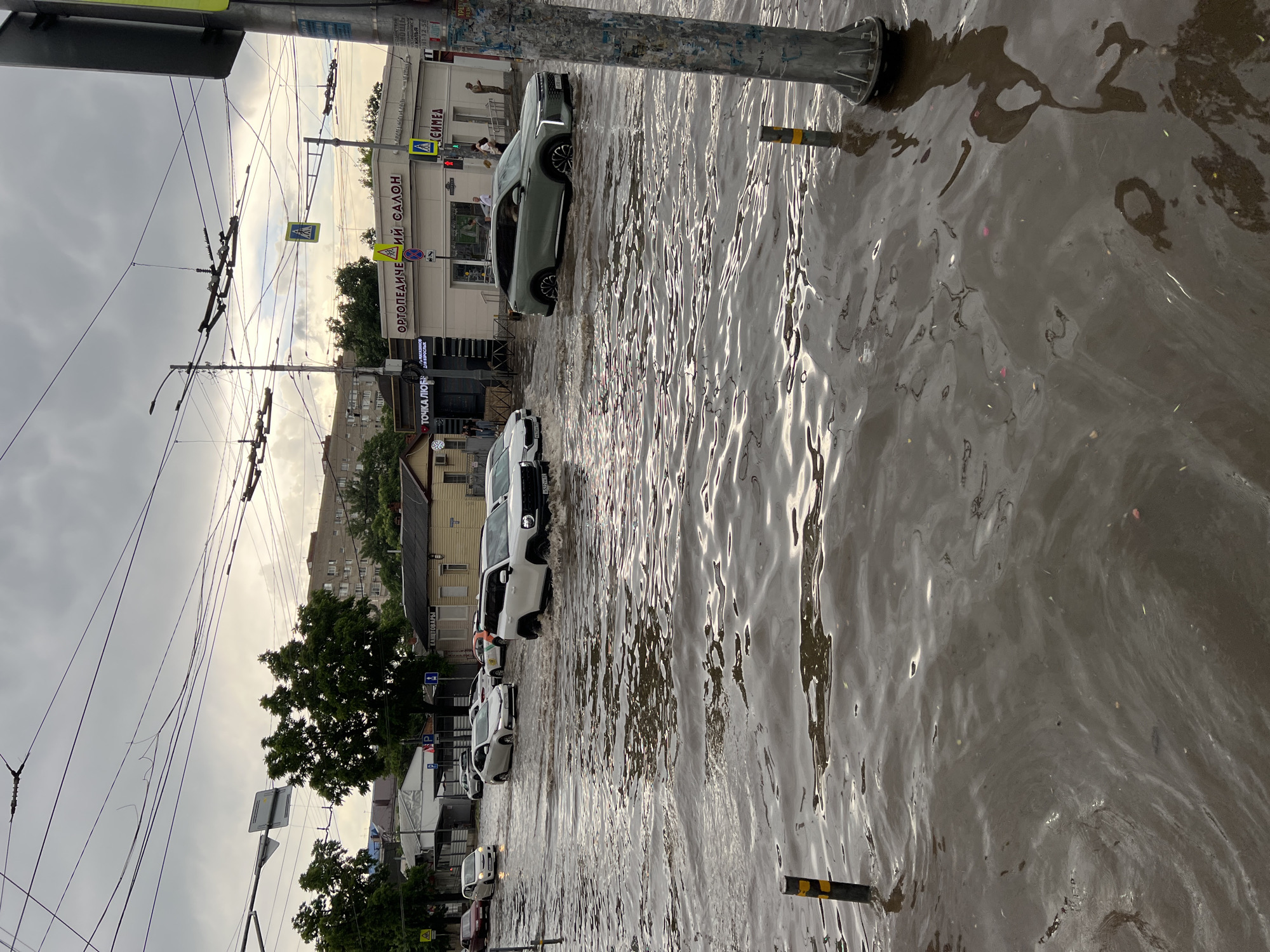 Krasnodar streets flood as vehicles, pedestrians navigate knee-deep water