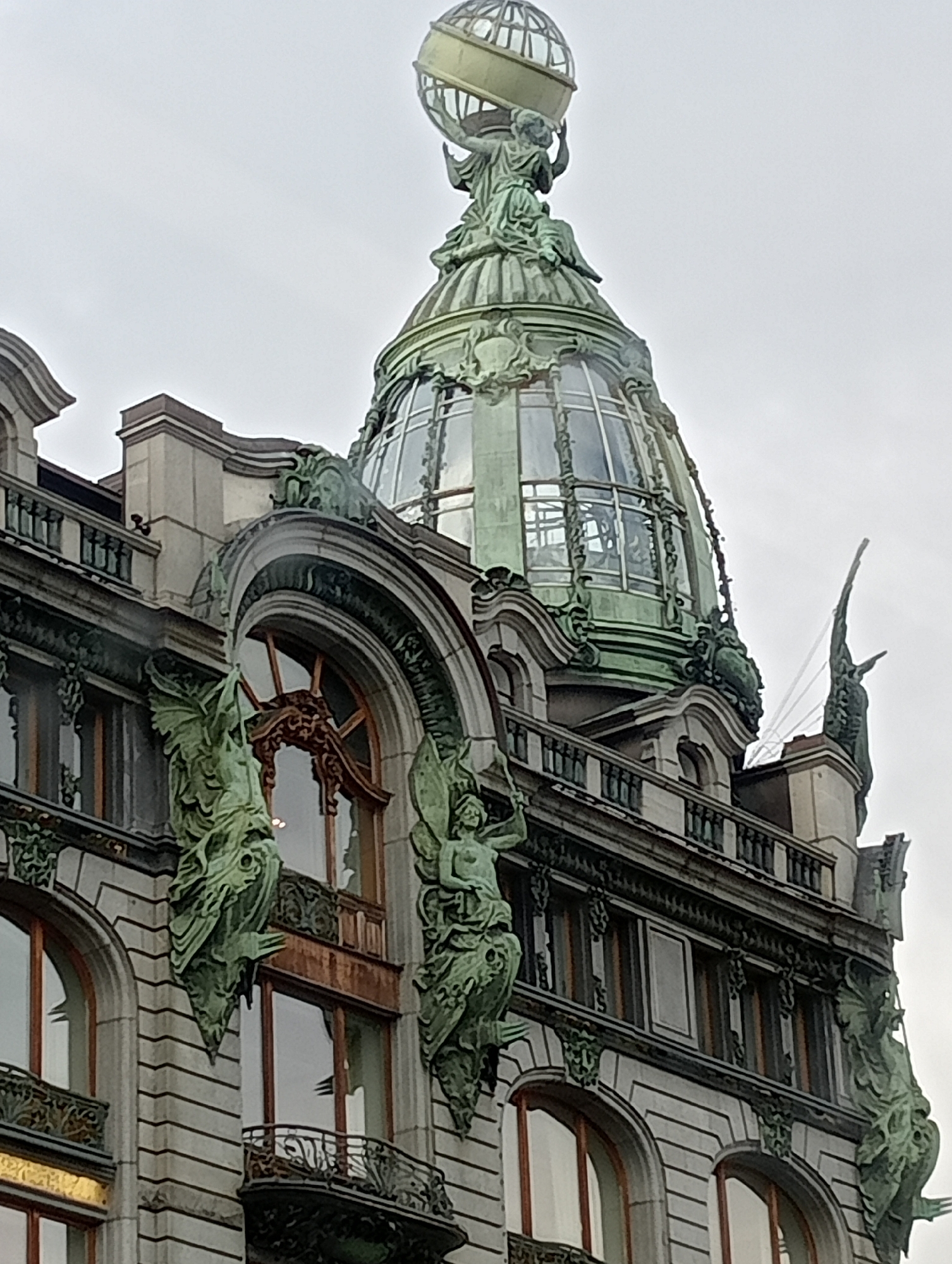 Strolling Nevsky Prospekt past the Singer House dome