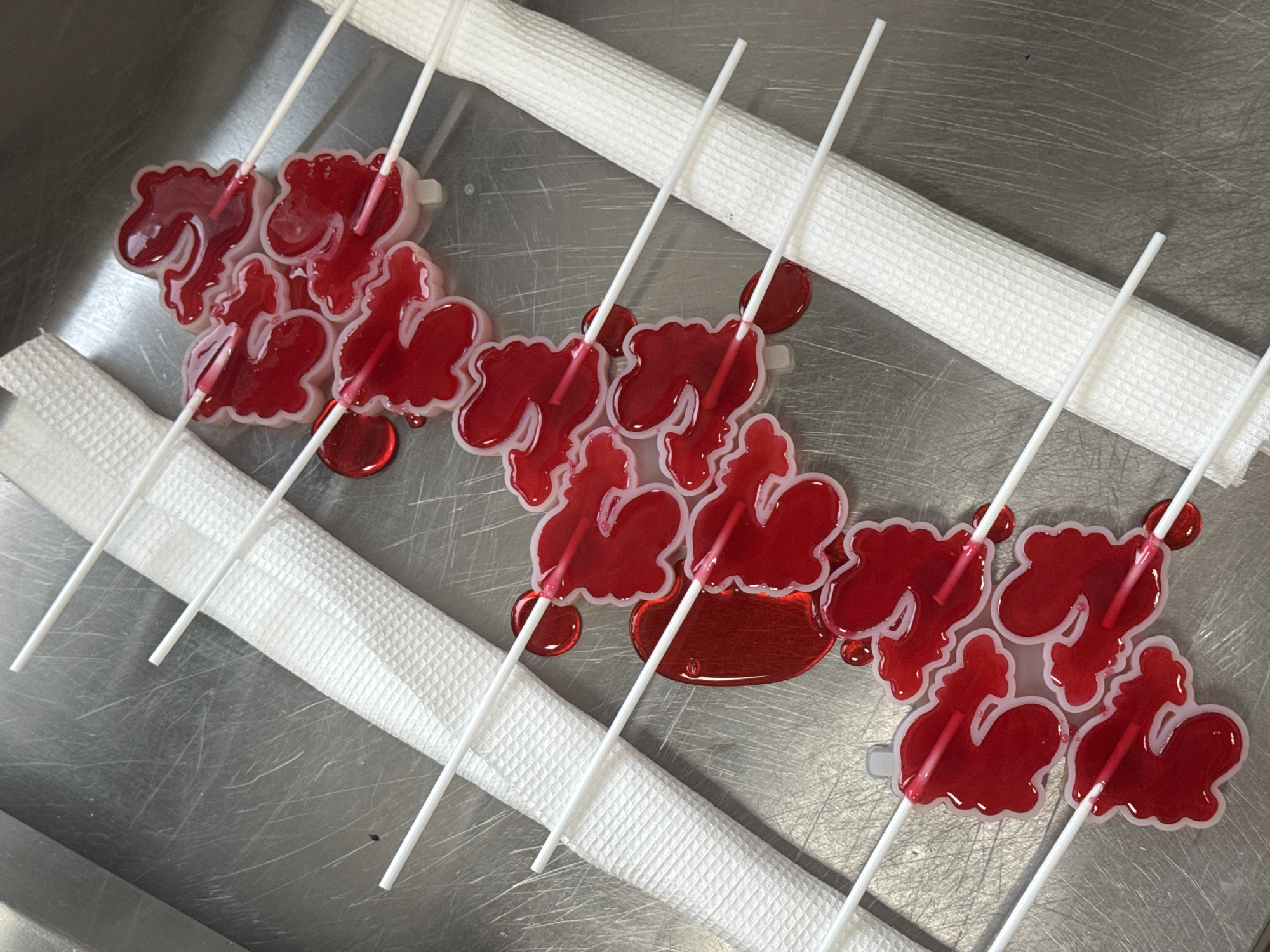 Cyrillic letter-shaped lollipops displayed on tray in Perm