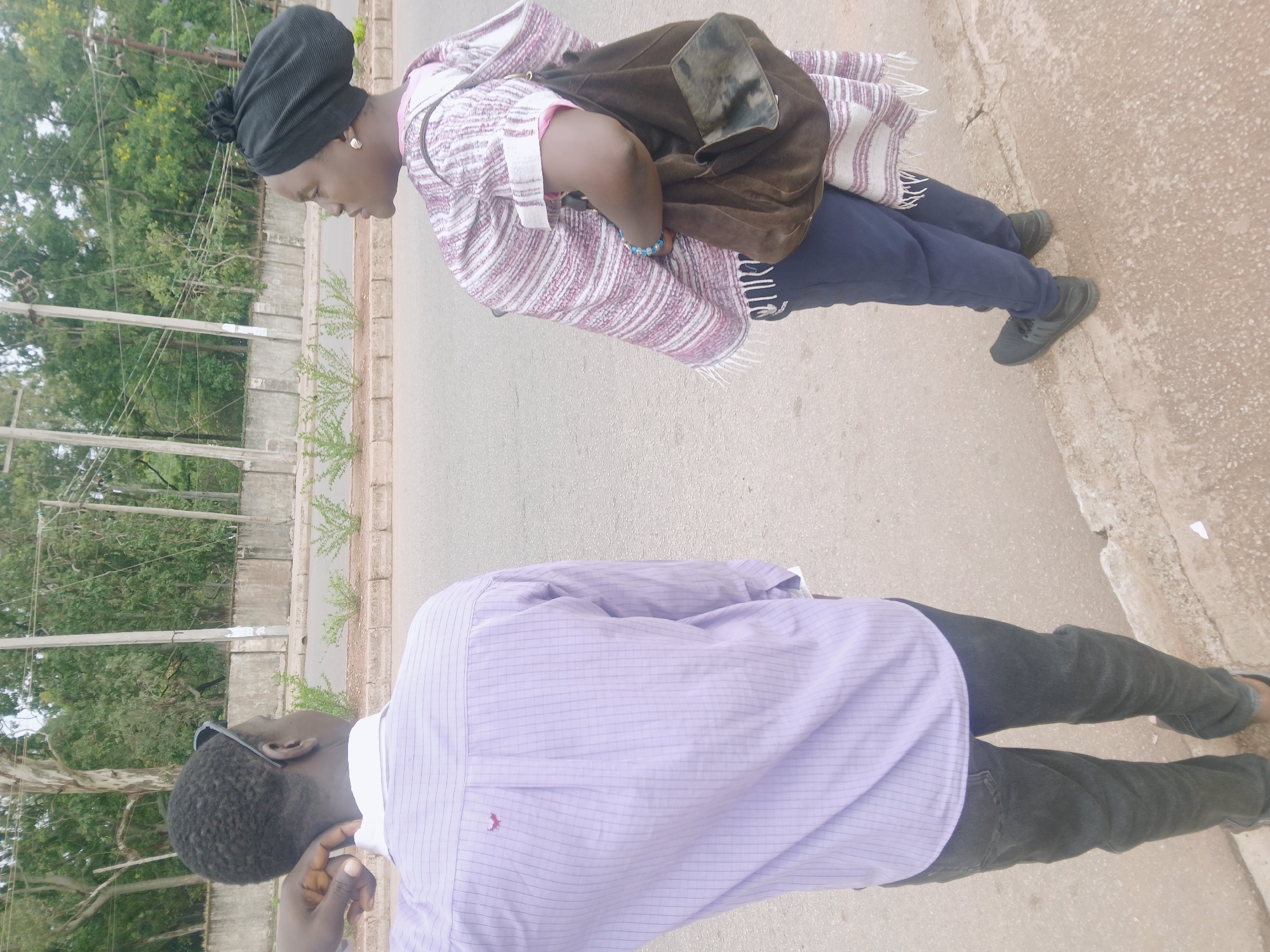 Morning street scene captures pedestrians and cyclist in Bukuru