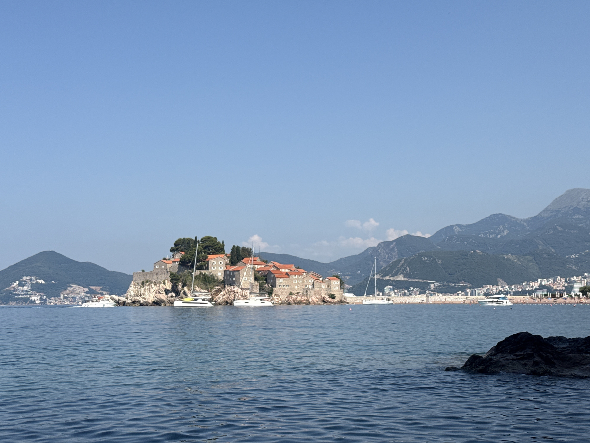 Morning on the water around Sveti Stefan's iconic island coastline