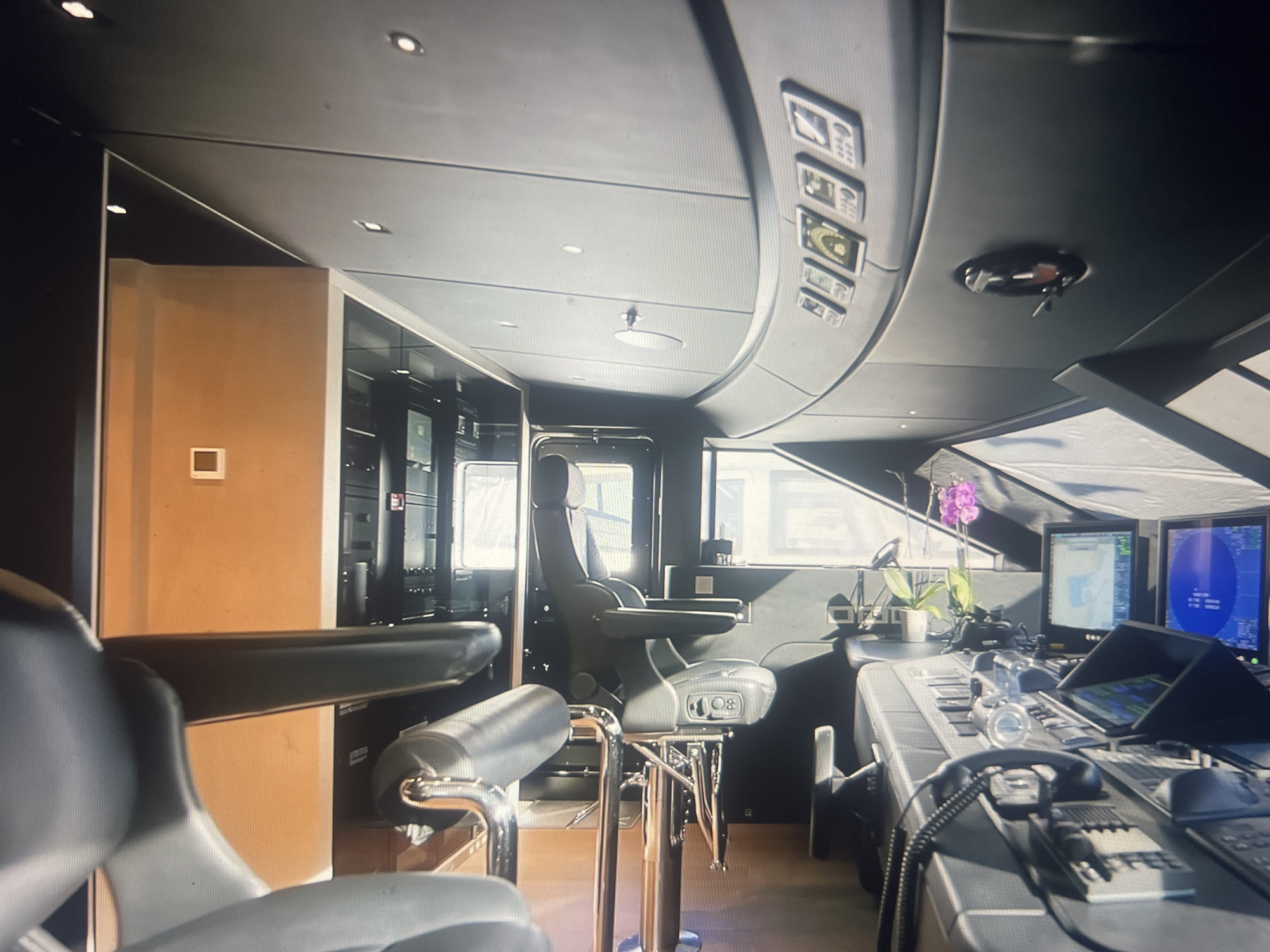 Luxury yacht and Porsche gathering documented in maritime setting