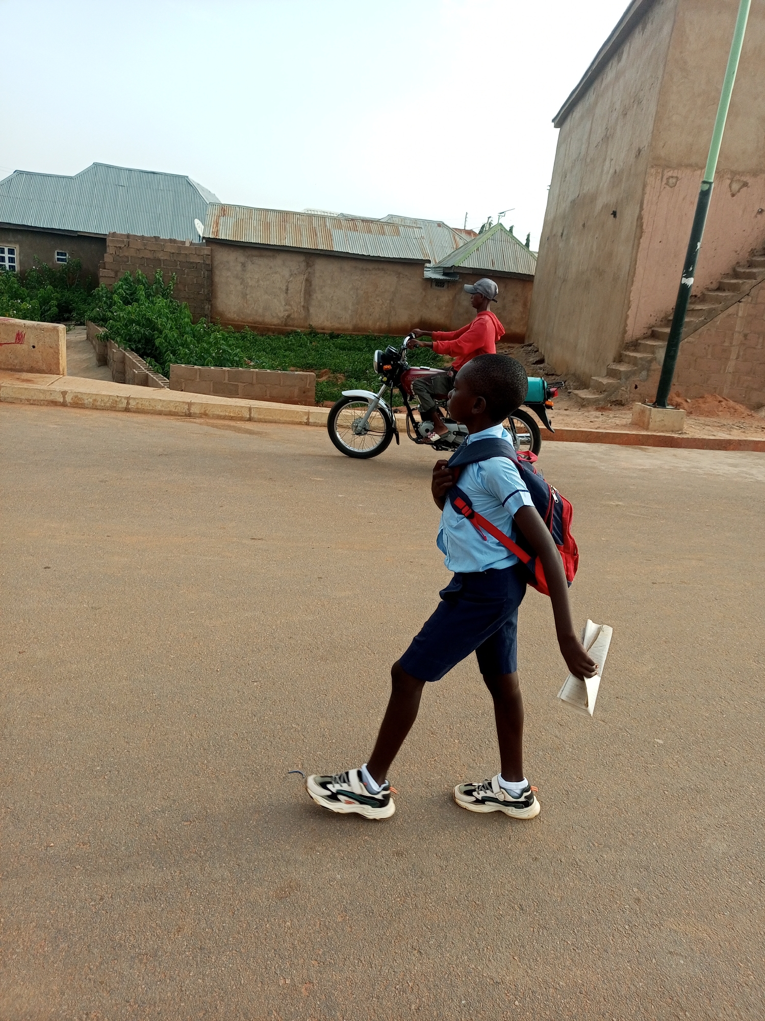 Morning foot traffic on the streets of Tempure and Garko, Nigeria