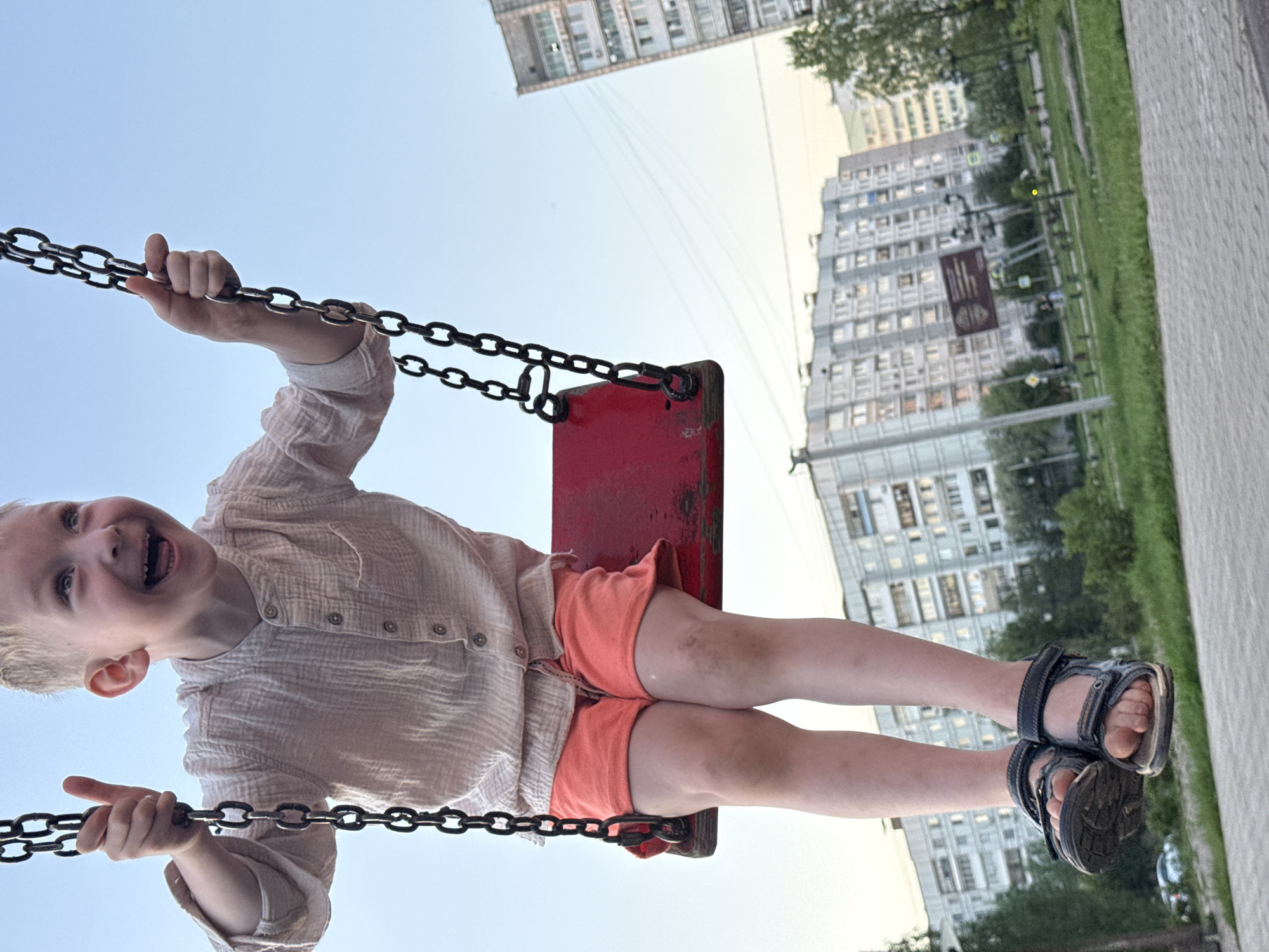 Children play at Chaikovsky playground during late afternoon sunset