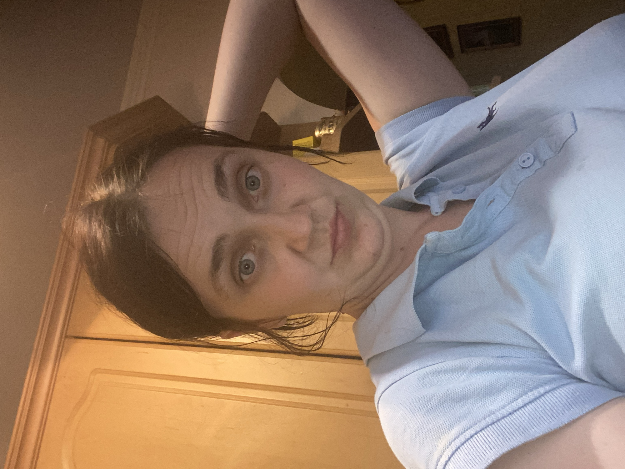 Afternoon selfie series in a light blue polo, various indoor settings