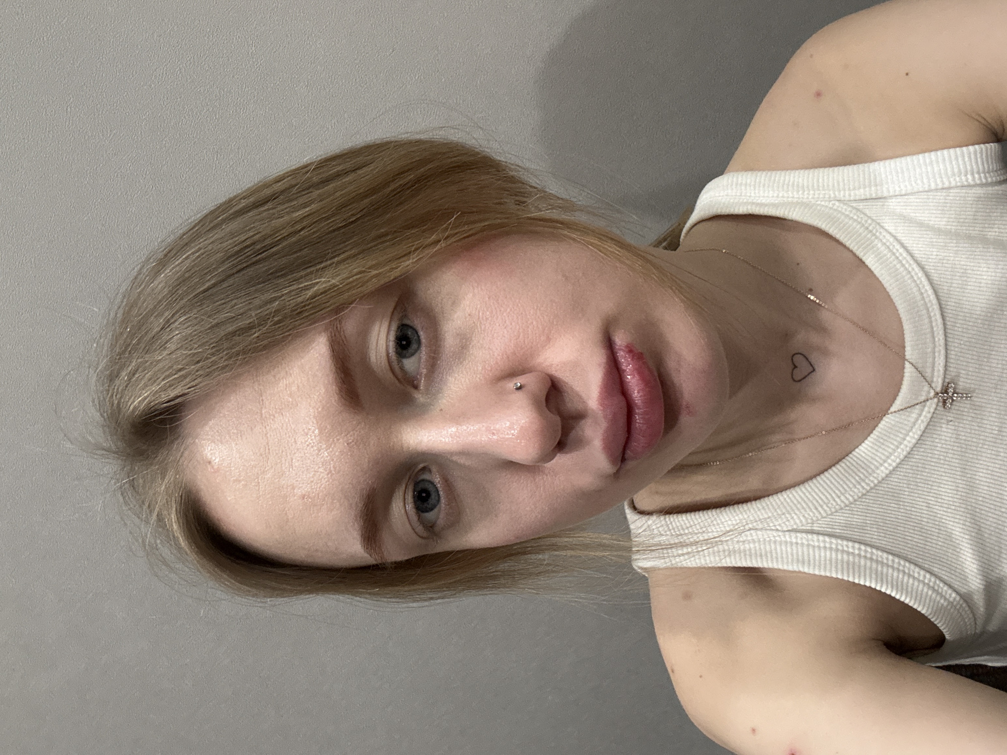 Woman takes multiple selfie portraits in Rostov-on-Don apartment