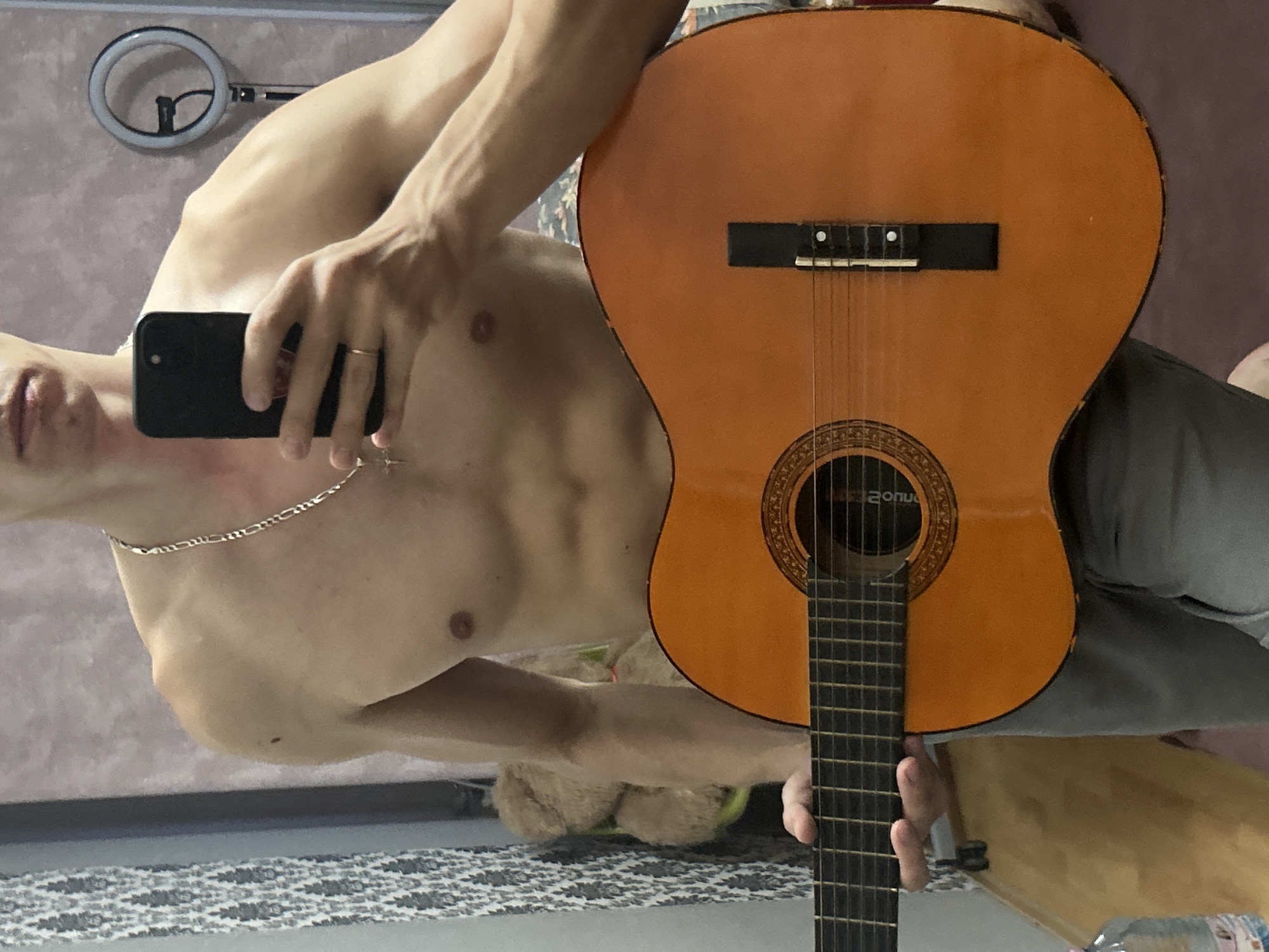 Guitar session and room details in Toruń, evening light