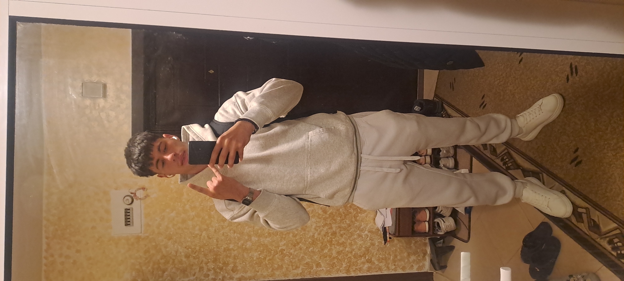 Young man takes mirror selfie in Burgas, Bulgaria