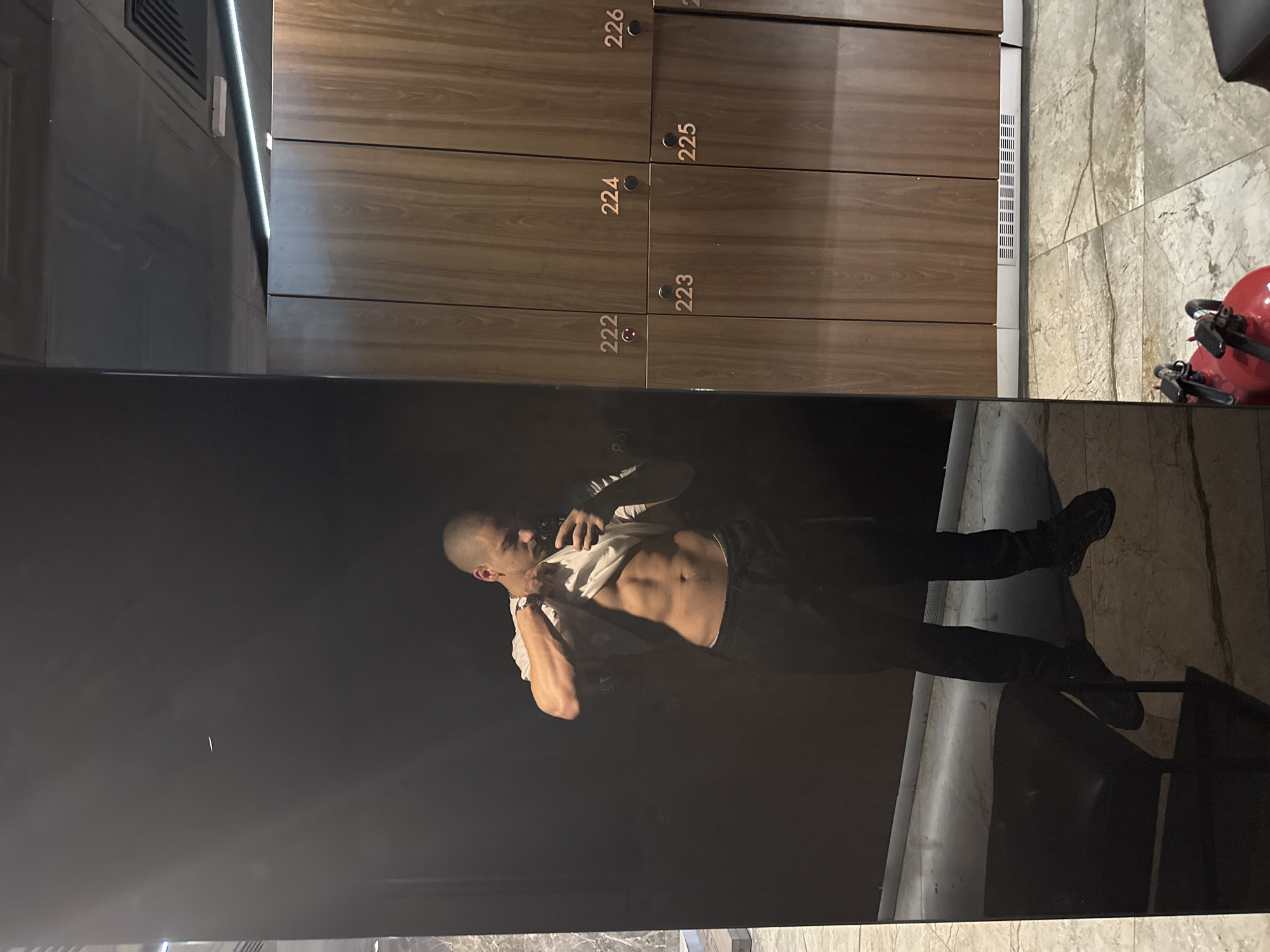 Man Takes Selfie in Numbered Locker Room Facility