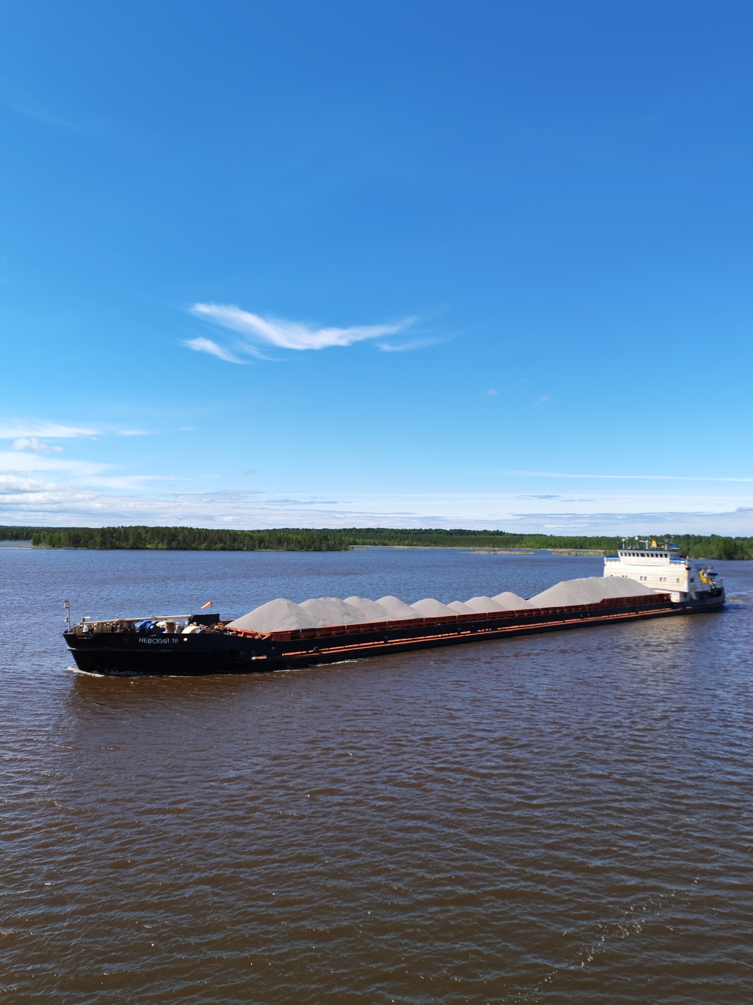 Cargo barges transport materials on Russian river
