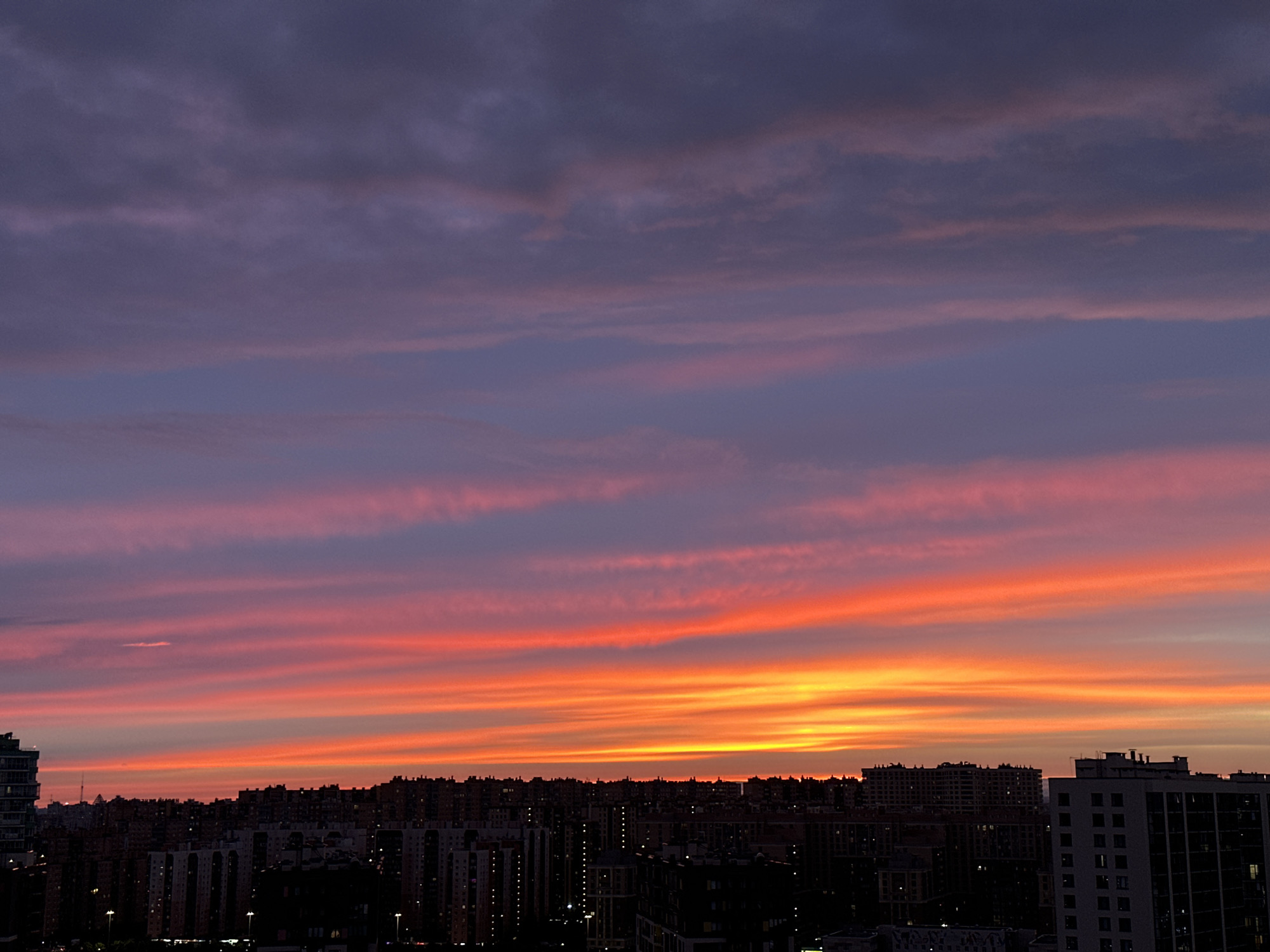 Saint Petersburg skyline glows under a vivid summer sunset