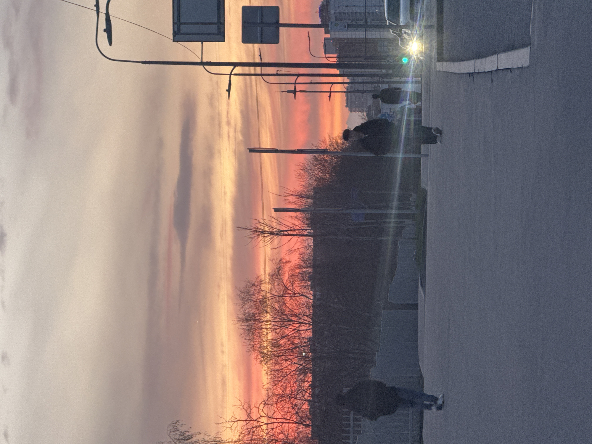 Sunset observed over Moscow street with colorful sky display
