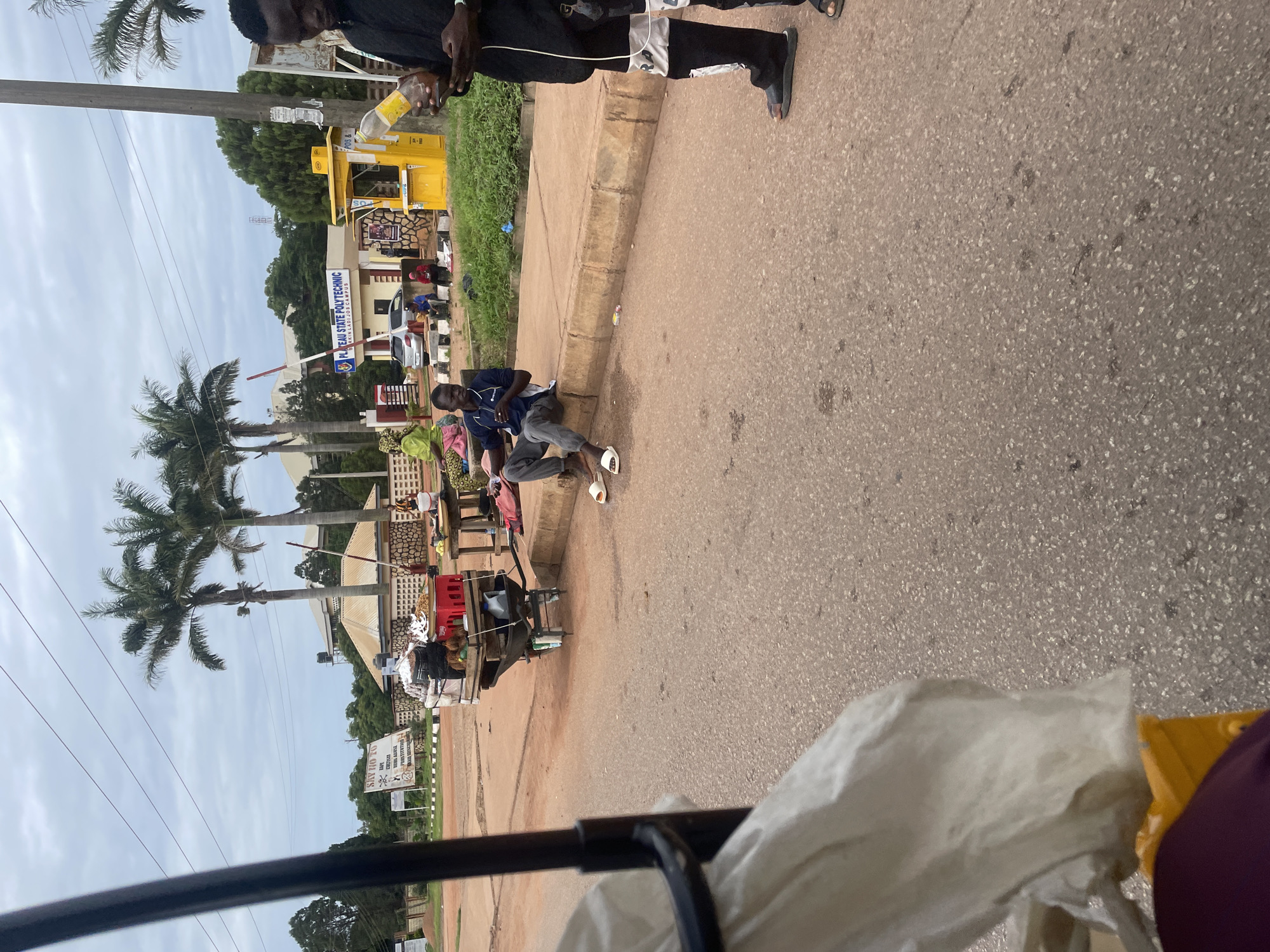 Everyday street traffic moving through central Jos, Nigeria