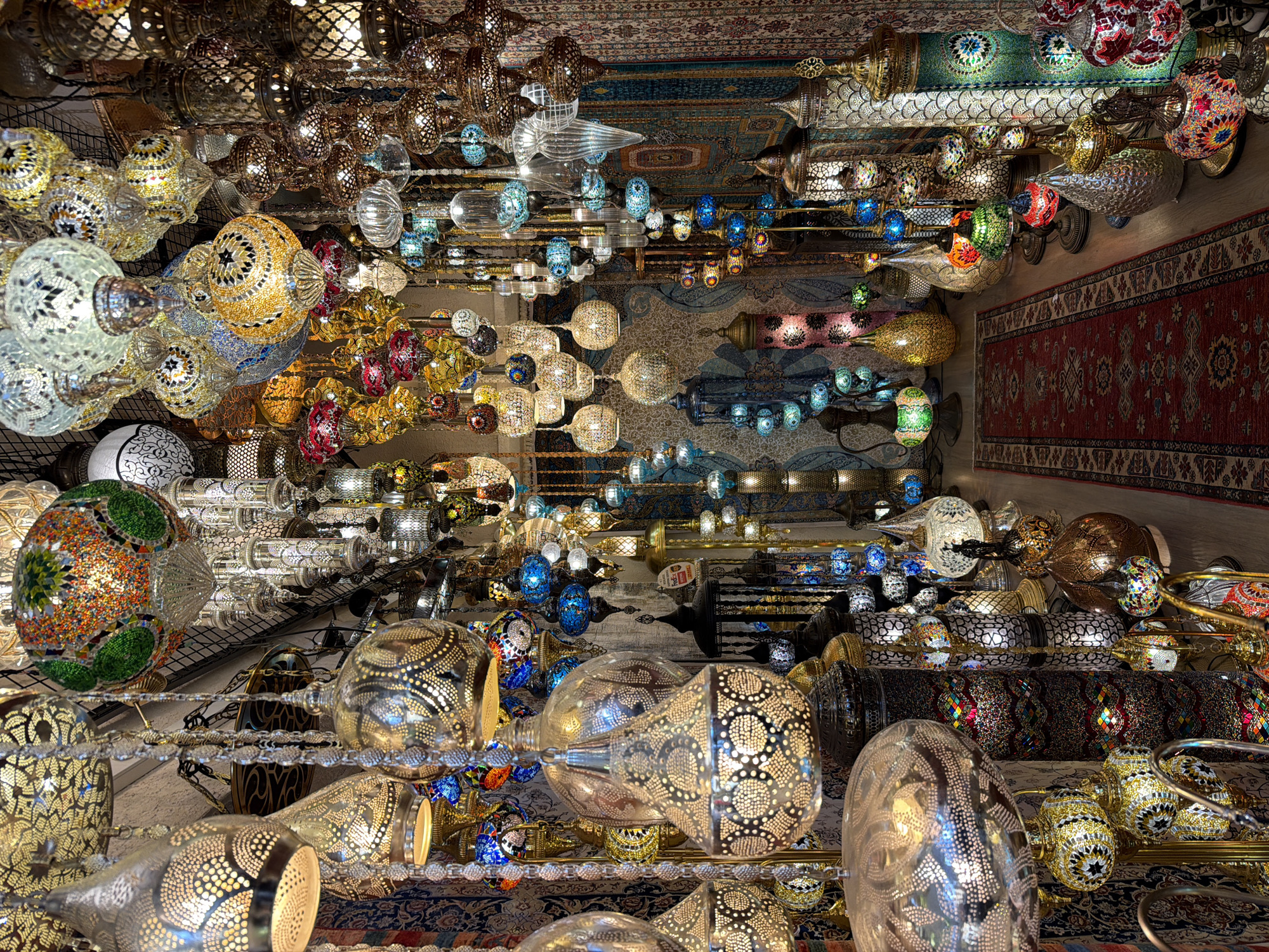 Tourist captures traditional Turkish lamp and carpet shop interior